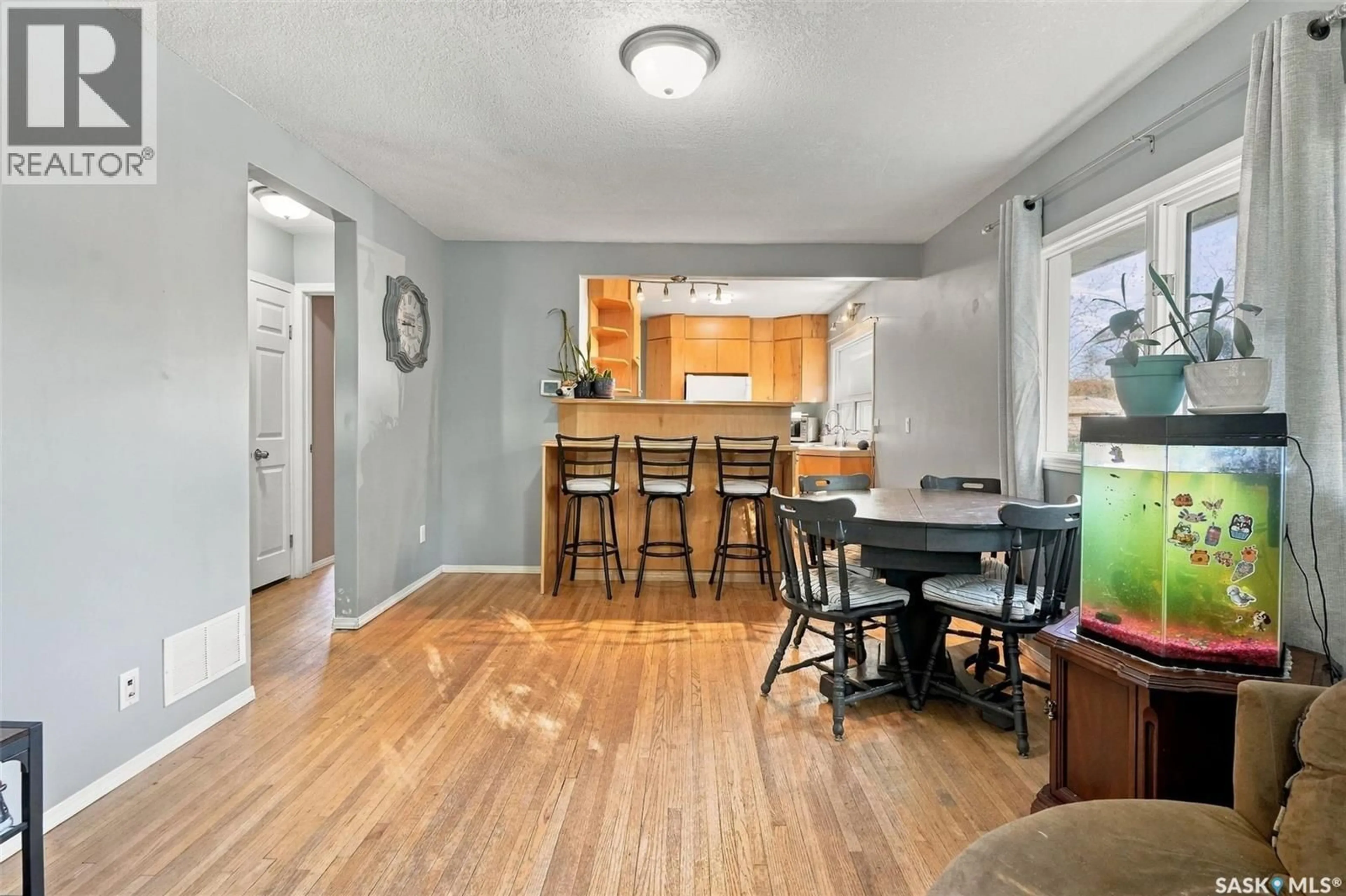 Open concept kitchen, wood/laminate floor for 2451 FRANCIS STREET, Regina Saskatchewan S4N2R1