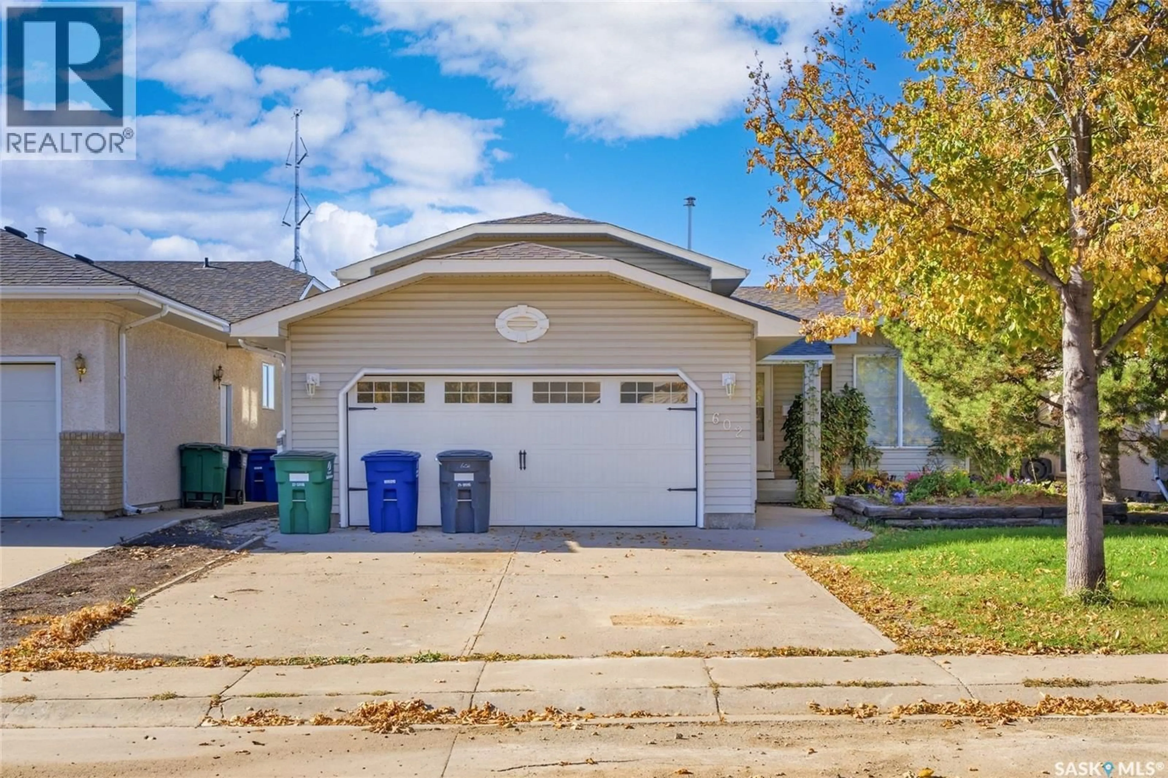 Home with vinyl exterior material, street for 602 HASLAM CRESCENT, Saskatoon Saskatchewan S7S1E8