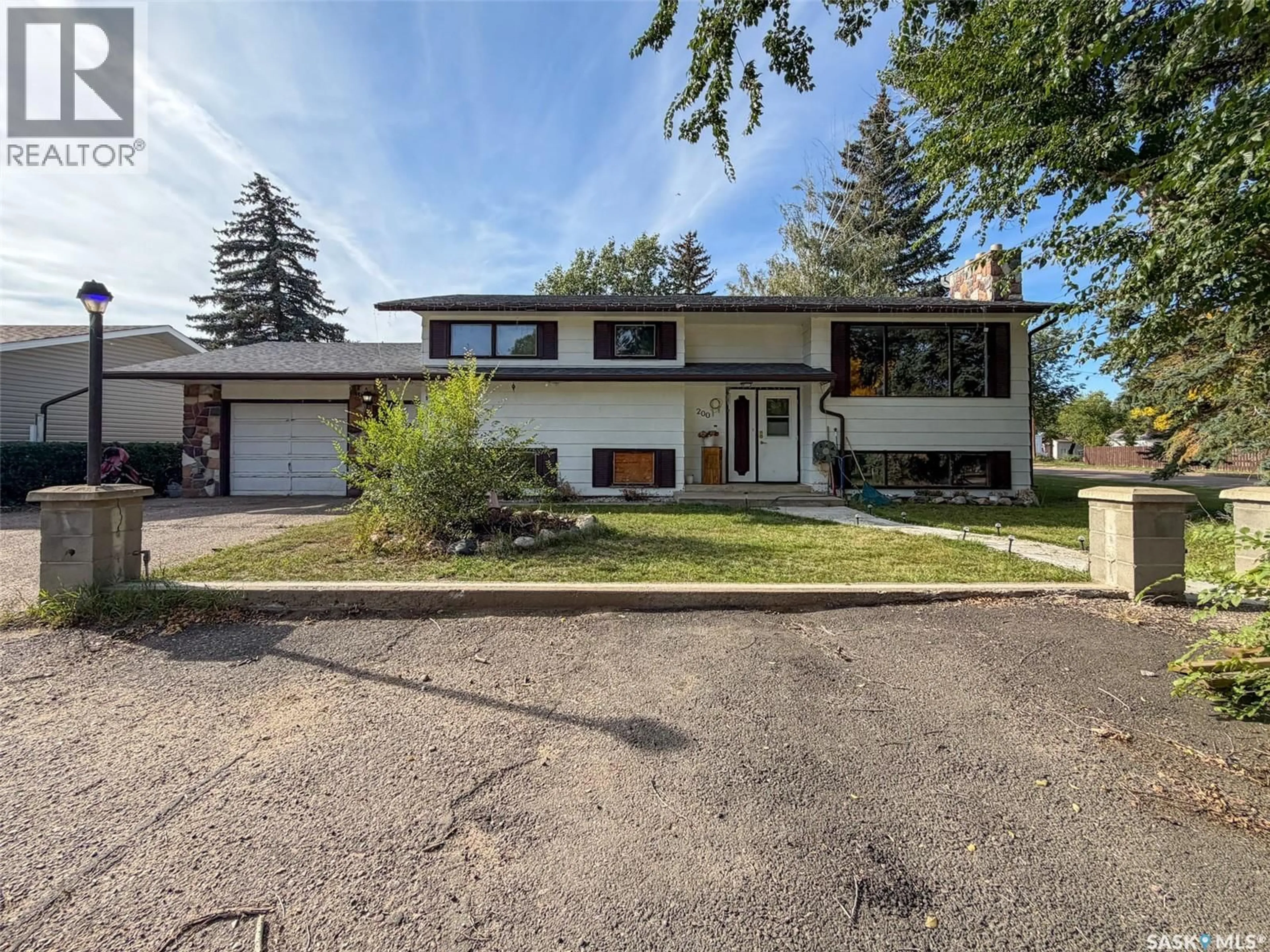 Home with vinyl exterior material, street for 200 3RD STREET, Ponteix Saskatchewan S0N1Z0