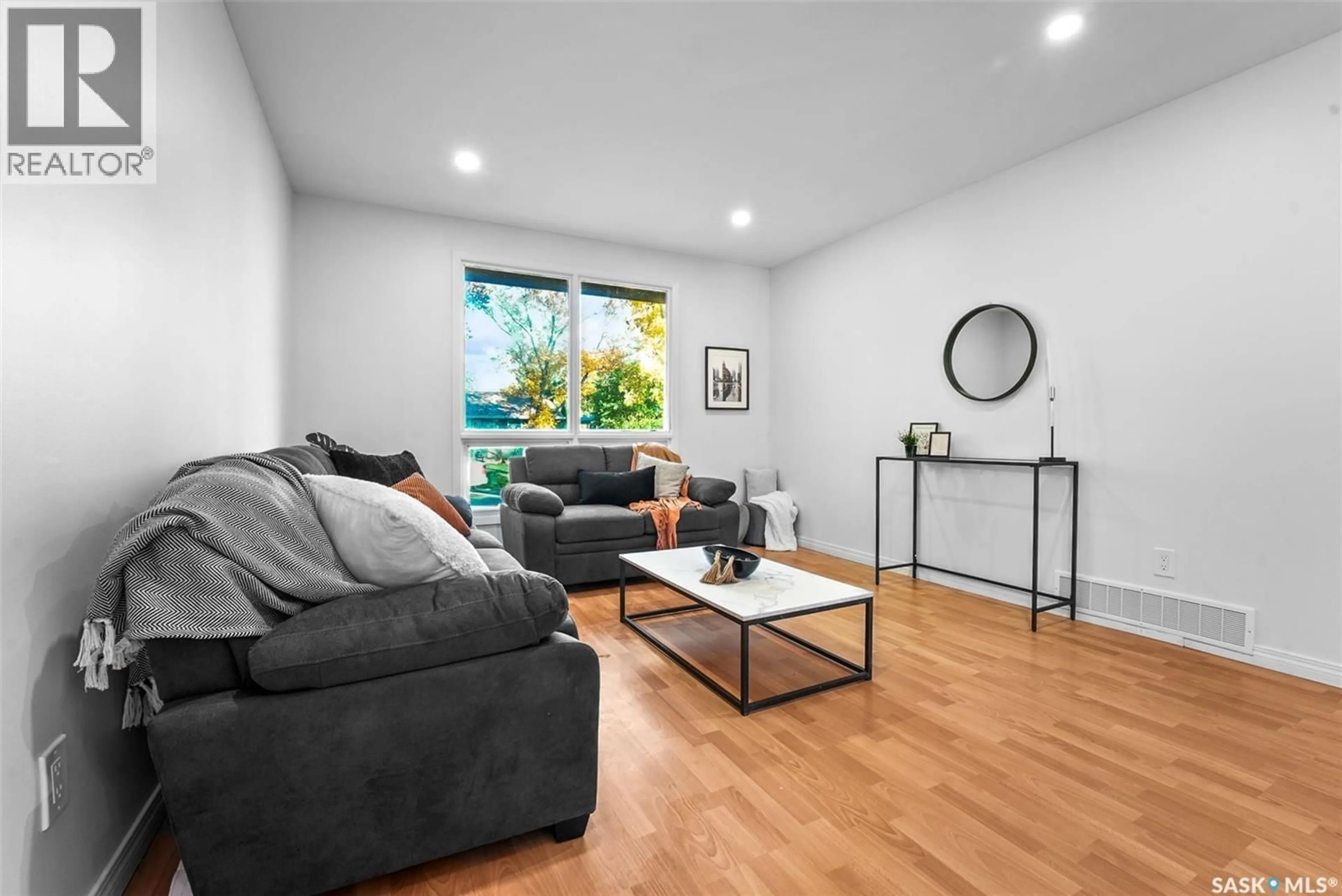 Living room with furniture, wood/laminate floor for 90 TURNER CRESCENT, Regina Saskatchewan S4N4P6