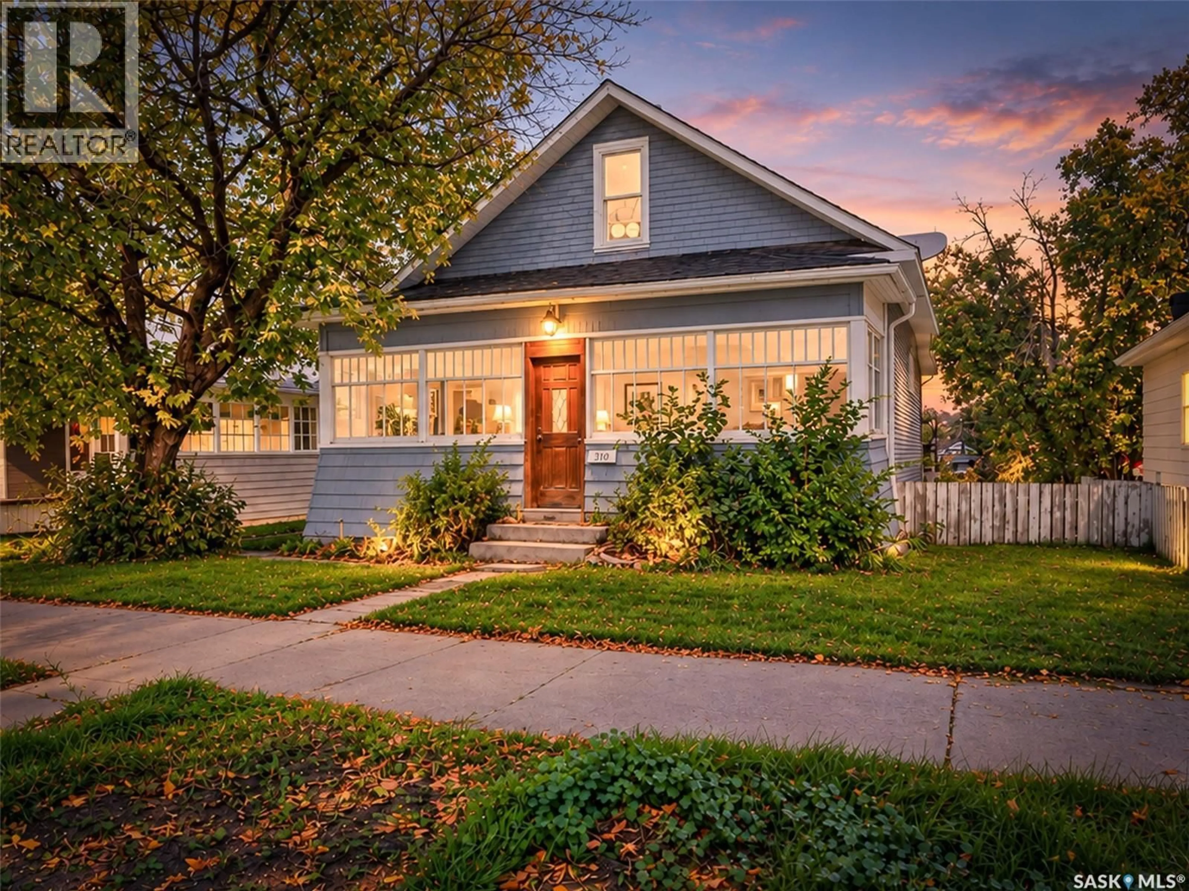 Home with vinyl exterior material, street for 310 COTEAU STREET, Moose Jaw Saskatchewan S6H5C9