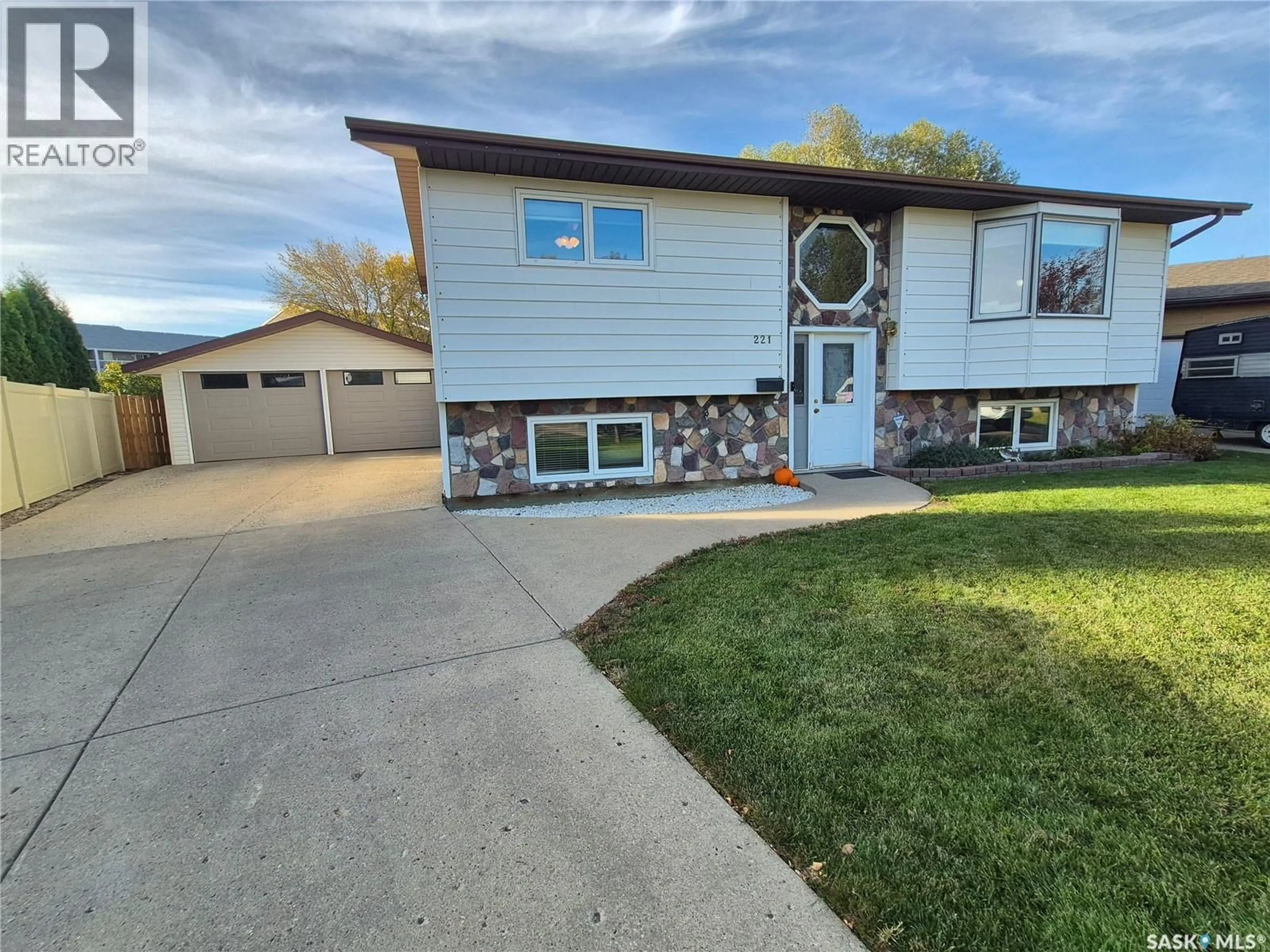 Home with vinyl exterior material, street for 221 BEAN CRESCENT, Weyburn Saskatchewan S4H3A3