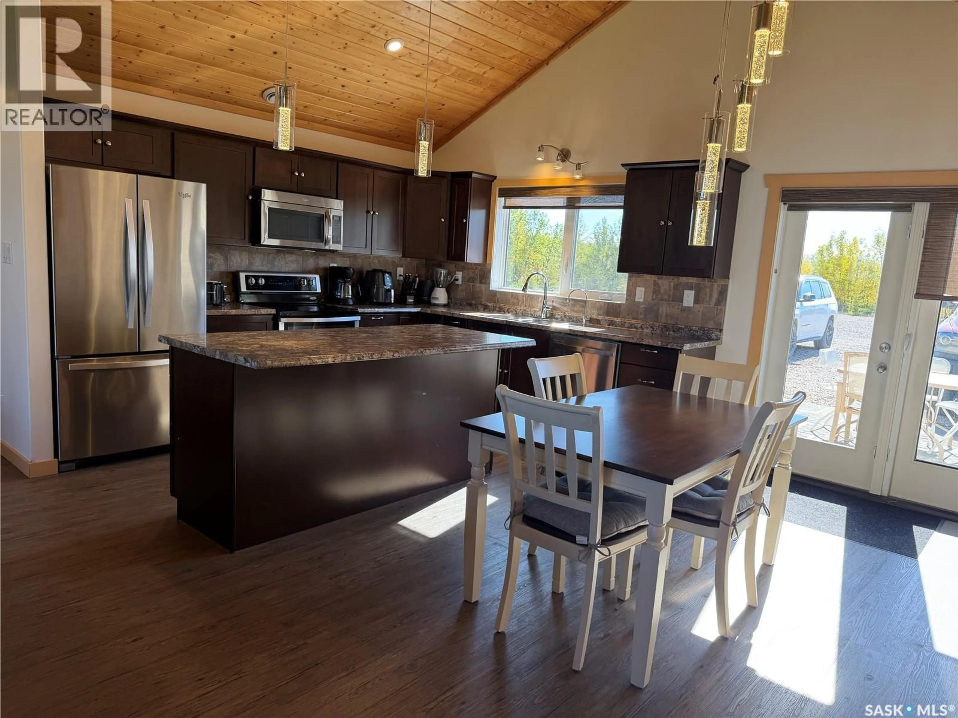 Open concept kitchen, wood/laminate floor for 16.86 ACRE ACREAGE-SHELL LAKE, Canwood Rm No. 494 Saskatchewan S0J2G0
