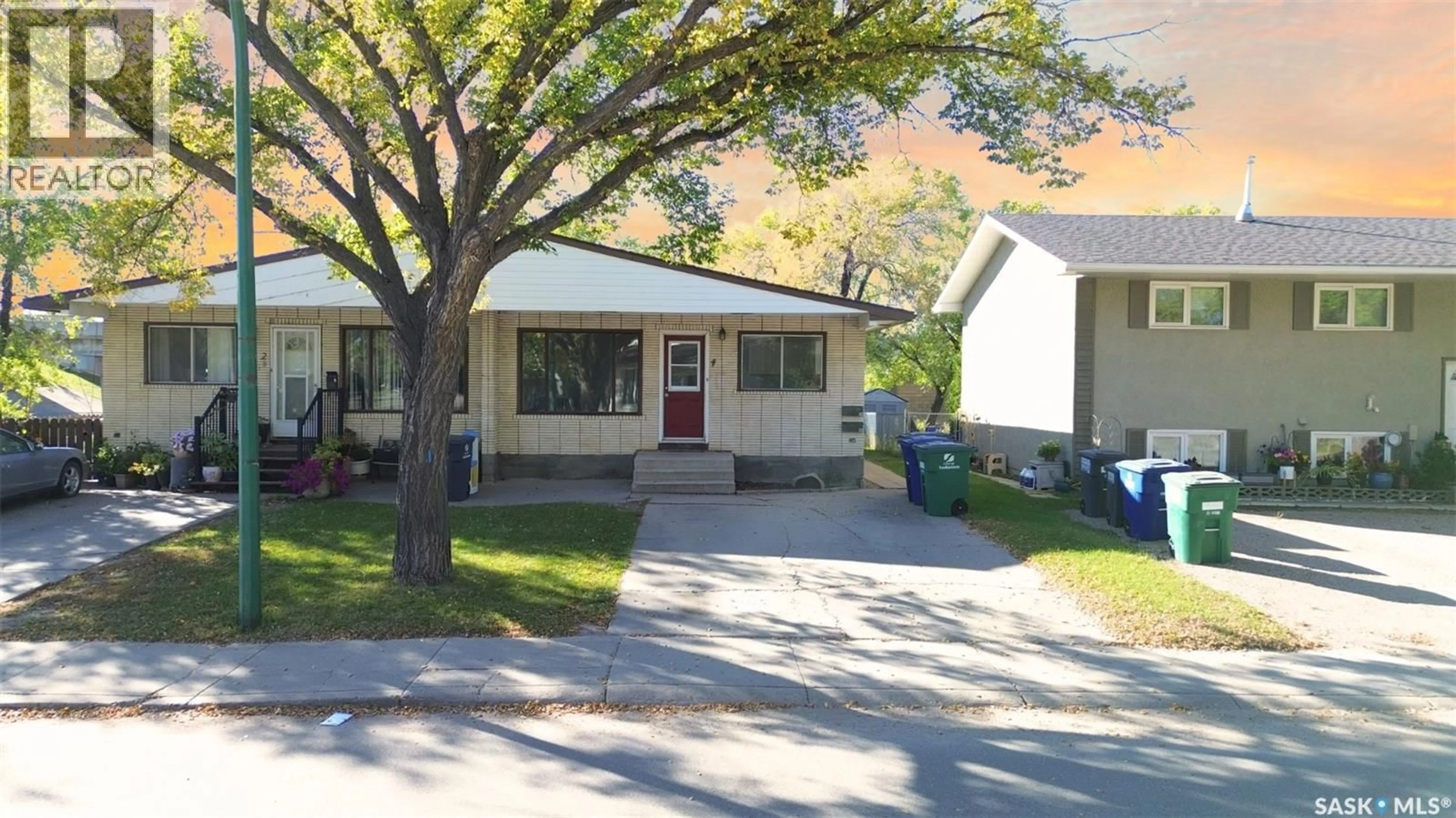 Home with vinyl exterior material, street for 4 CARLETON DRIVE, Saskatoon Saskatchewan S7H3N6