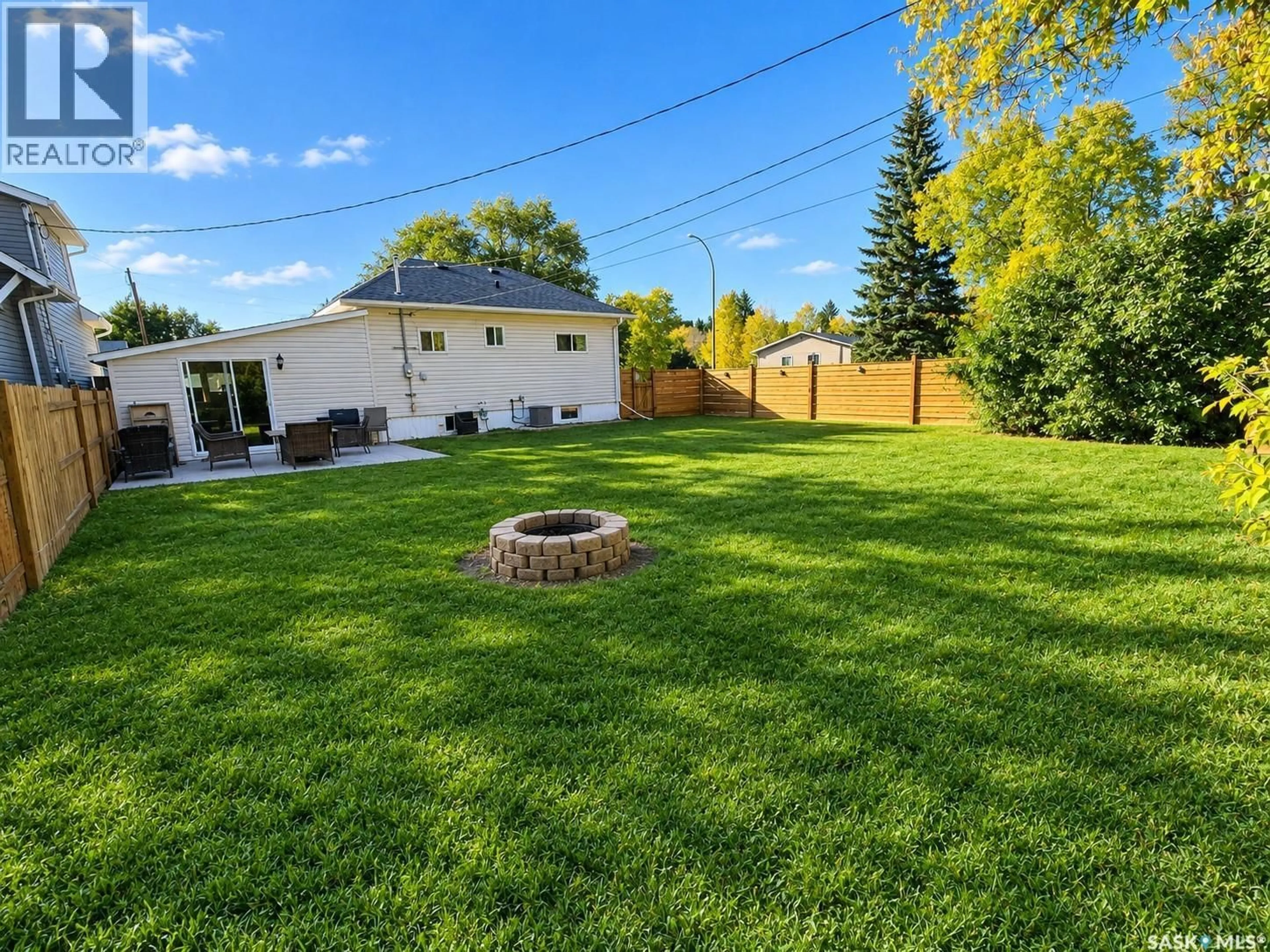 A pic from outside/outdoor area/front of a property/back of a property/a pic from drone, street for 136 10TH STREET, Weyburn Saskatchewan S4H1G9