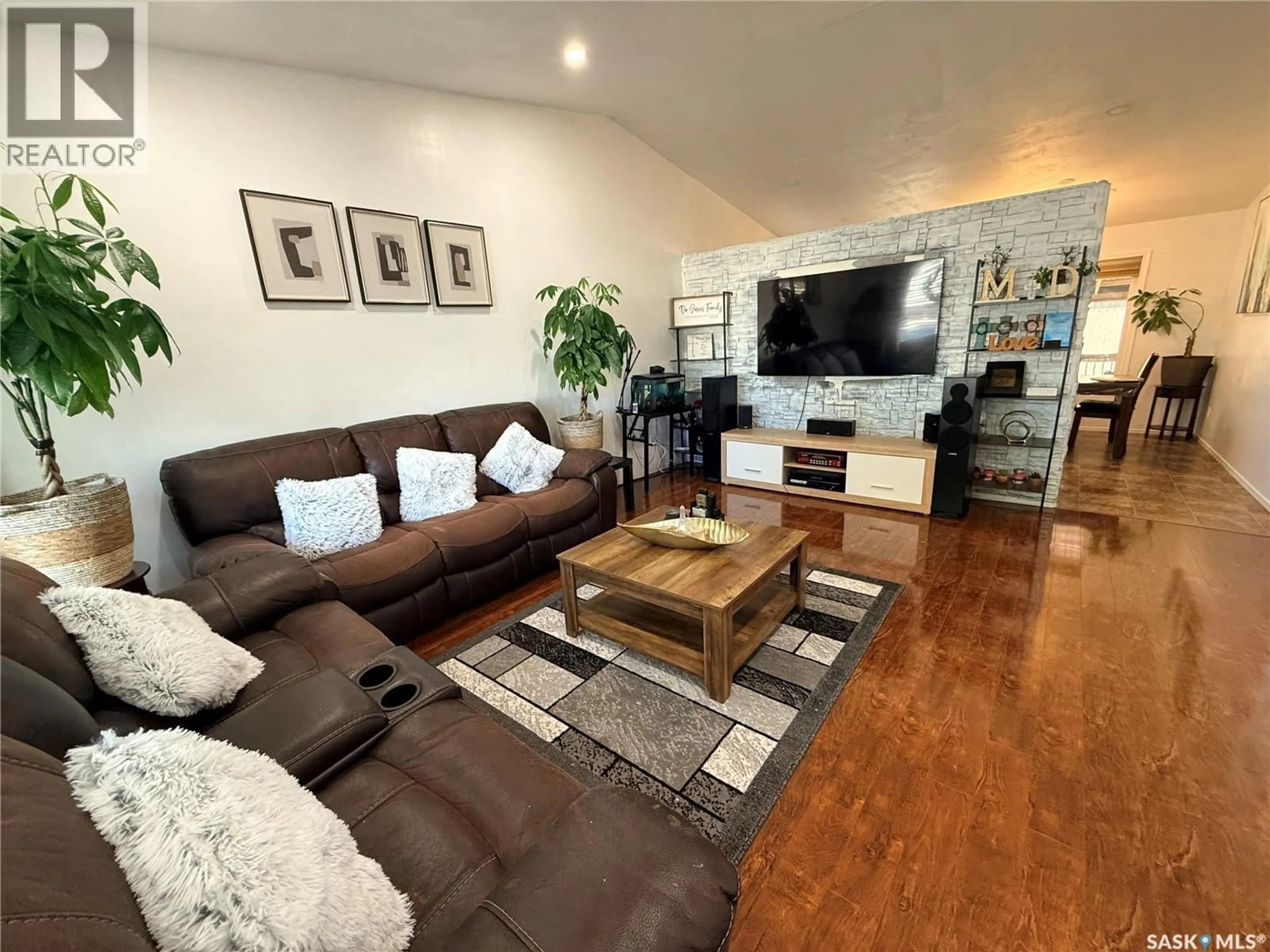 Living room with furniture, wood/laminate floor for 119 HALL CRESCENT, Saskatoon Saskatchewan S7L7G7