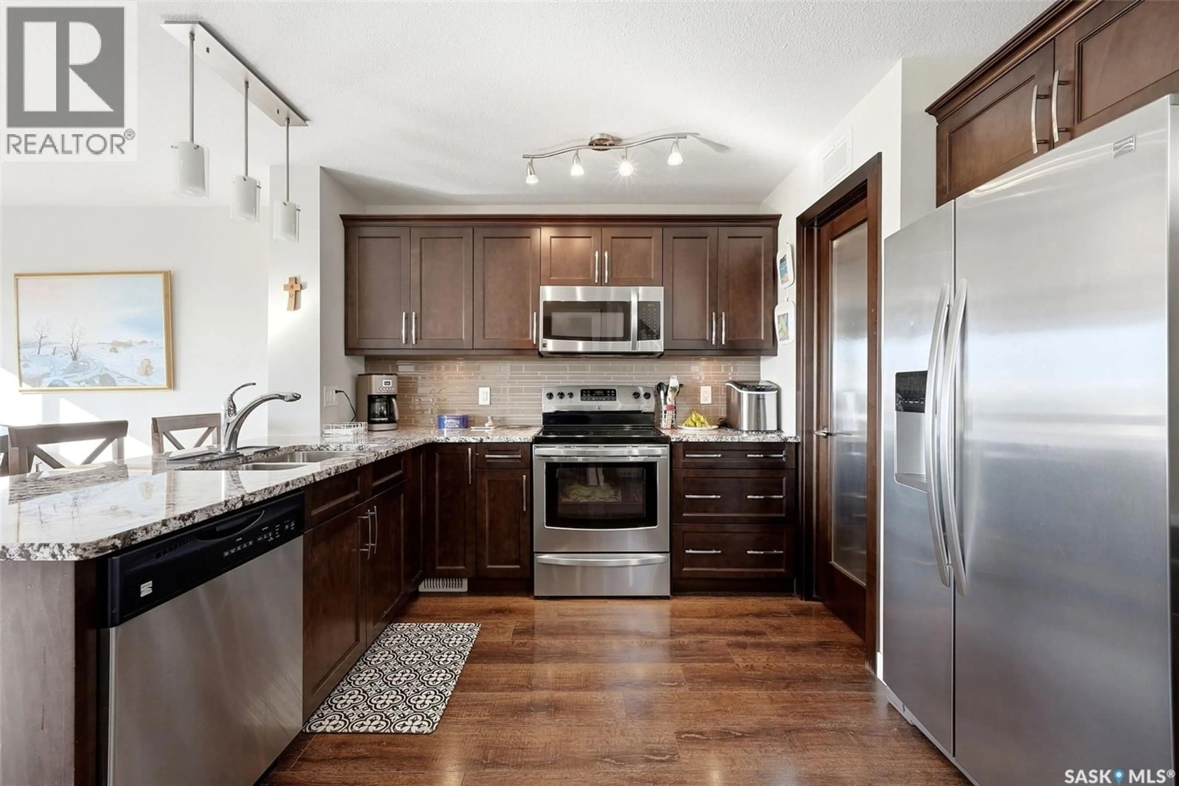 Open concept kitchen, ceramic/tile floor for 8837 KESTRAL DRIVE, Regina Saskatchewan S4Y0C2