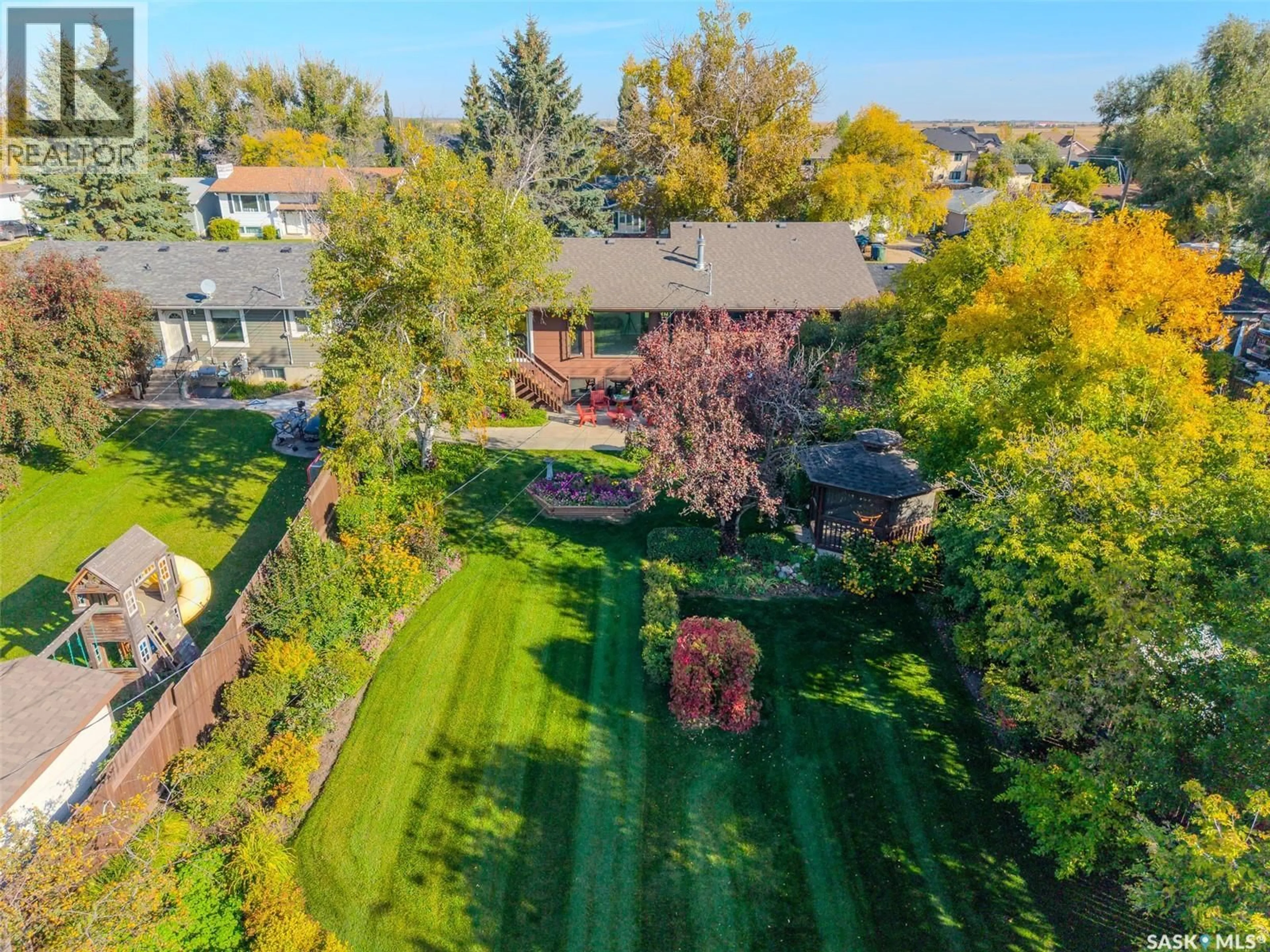 A pic from outside/outdoor area/front of a property/back of a property/a pic from drone, street for 619 CLOVER AVENUE, Dalmeny Saskatchewan S0K1E0