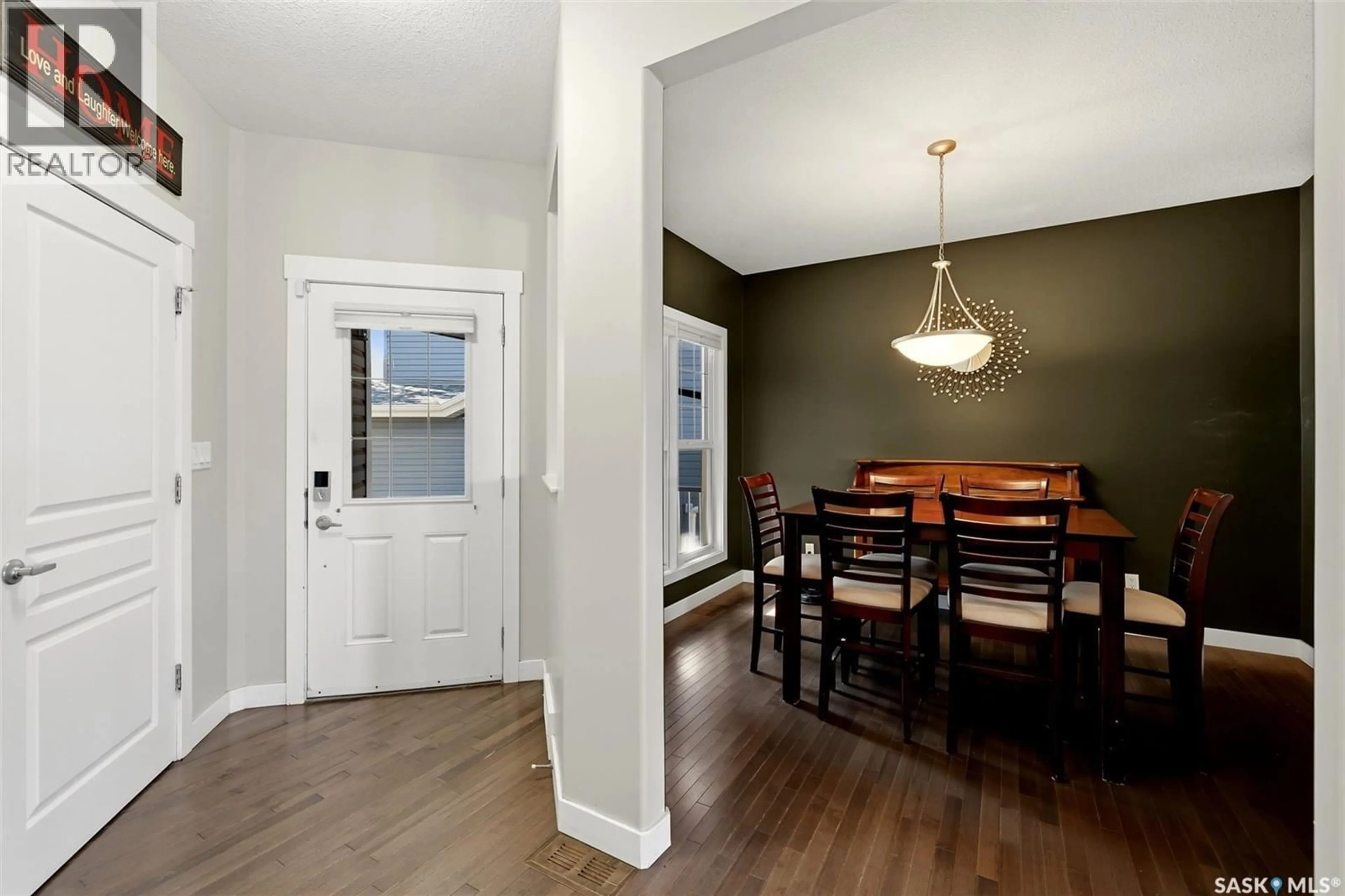 Dining room, wood/laminate floor for 113 POPLAR BLUFF CRESCENT, Regina Saskatchewan S4Y0B5