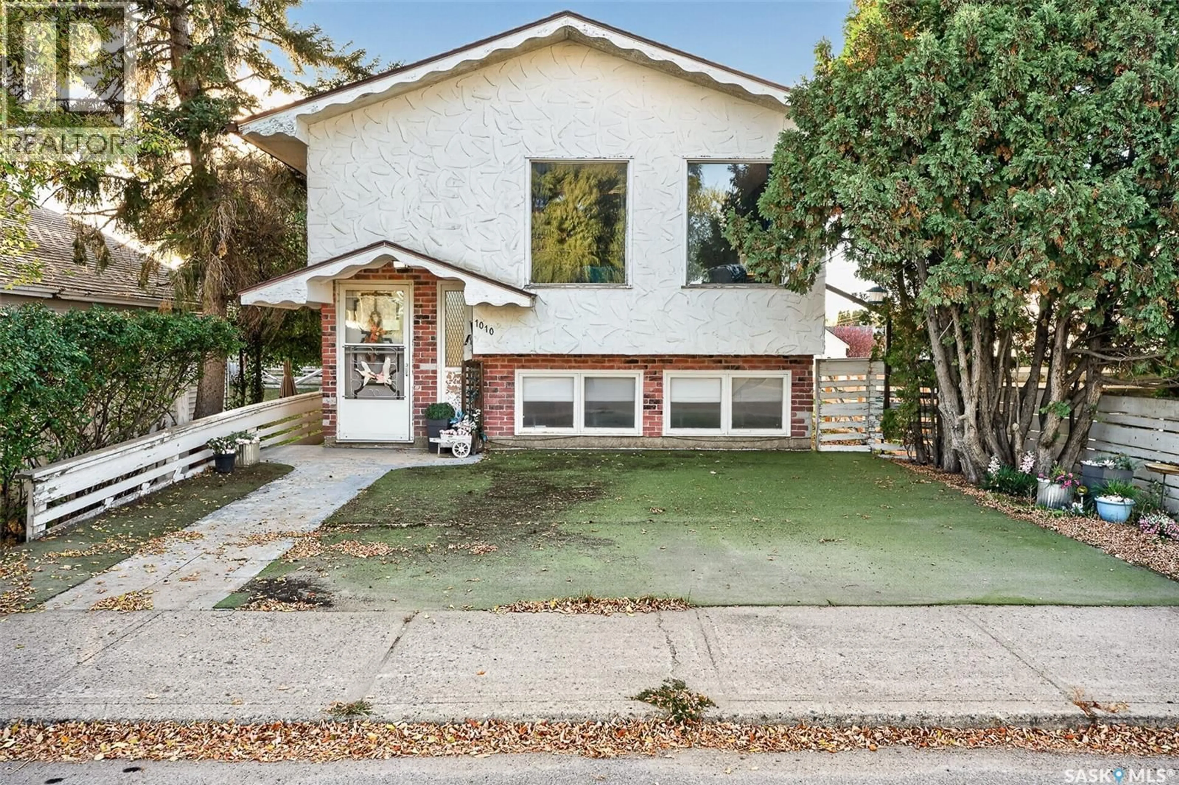 Home with brick exterior material, street for 1010 9TH AVENUE, Moose Jaw Saskatchewan S6H5X5