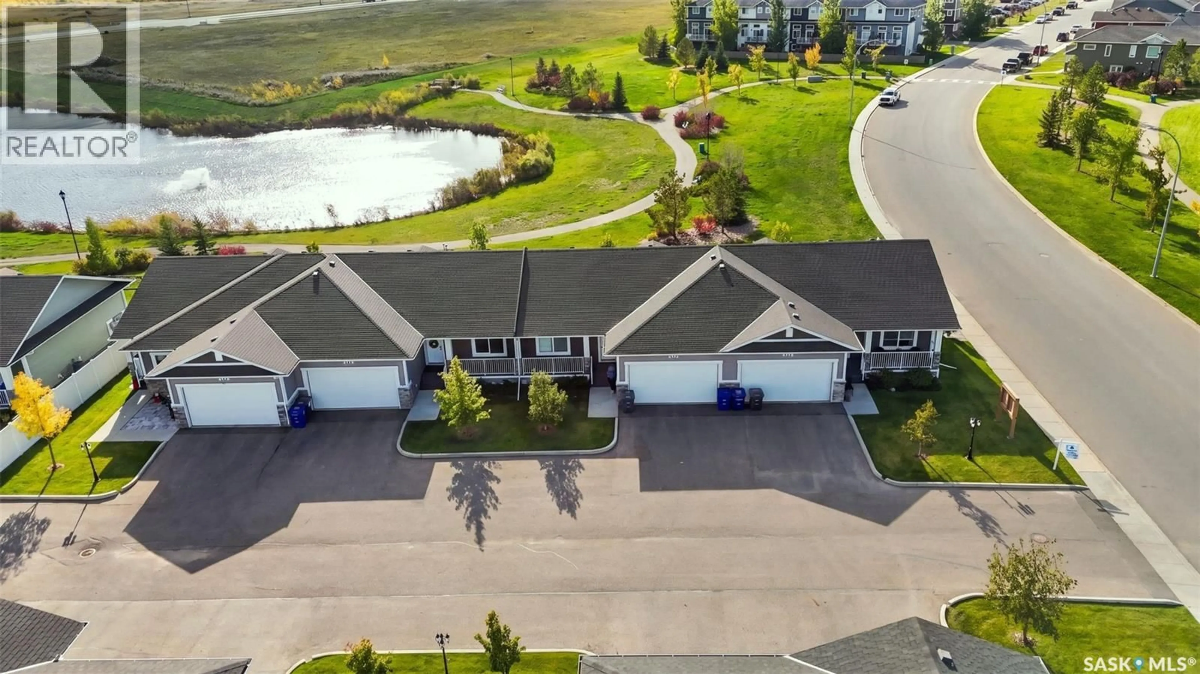 A pic from outside/outdoor area/front of a property/back of a property/a pic from drone, water/lake/river/ocean view for 202 - 1200 PARR HILL DRIVE, Martensville Saskatchewan S0K2T1