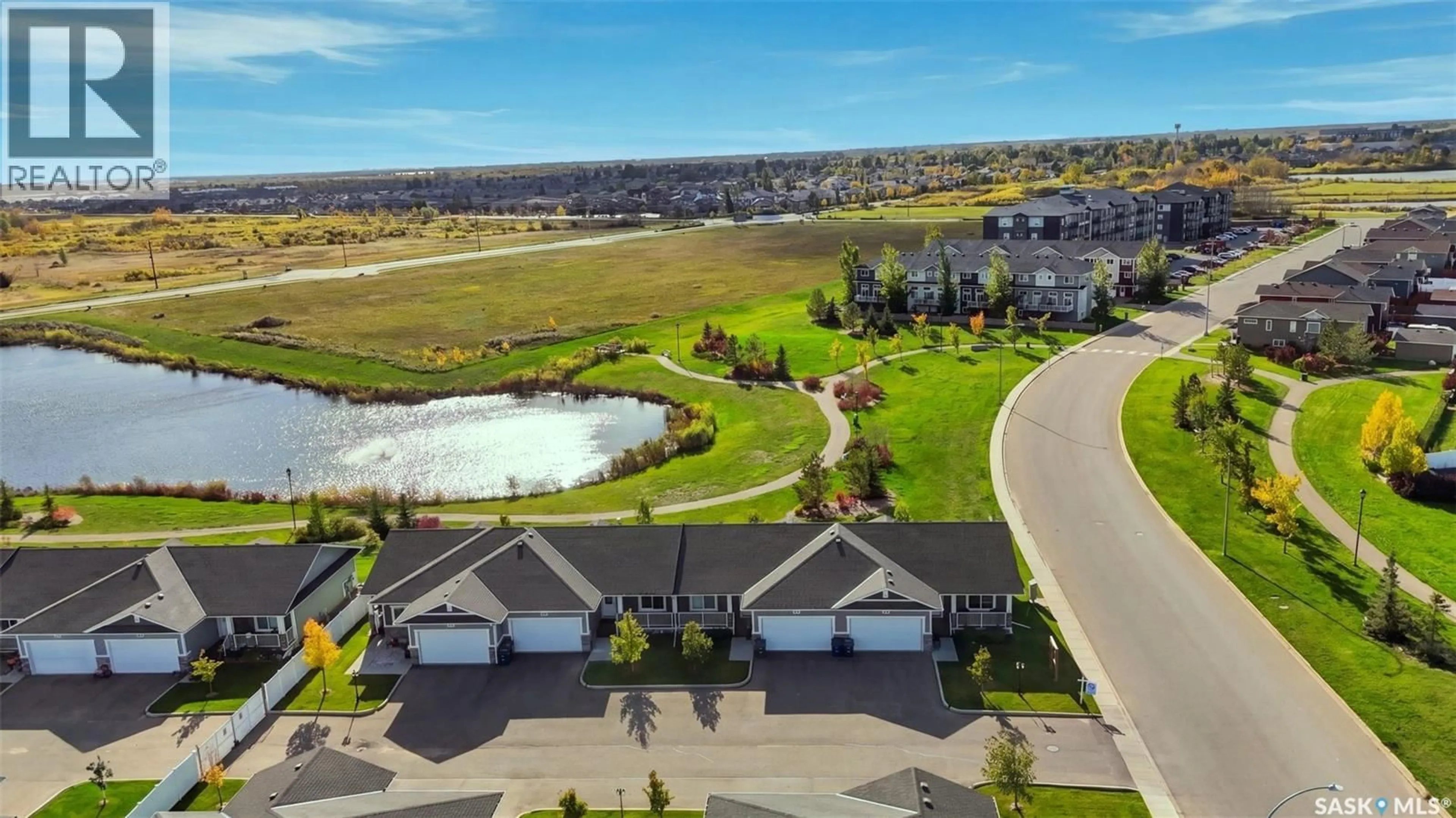 A pic from outside/outdoor area/front of a property/back of a property/a pic from drone, water/lake/river/ocean view for 202 - 1200 PARR HILL DRIVE, Martensville Saskatchewan S0K2T1