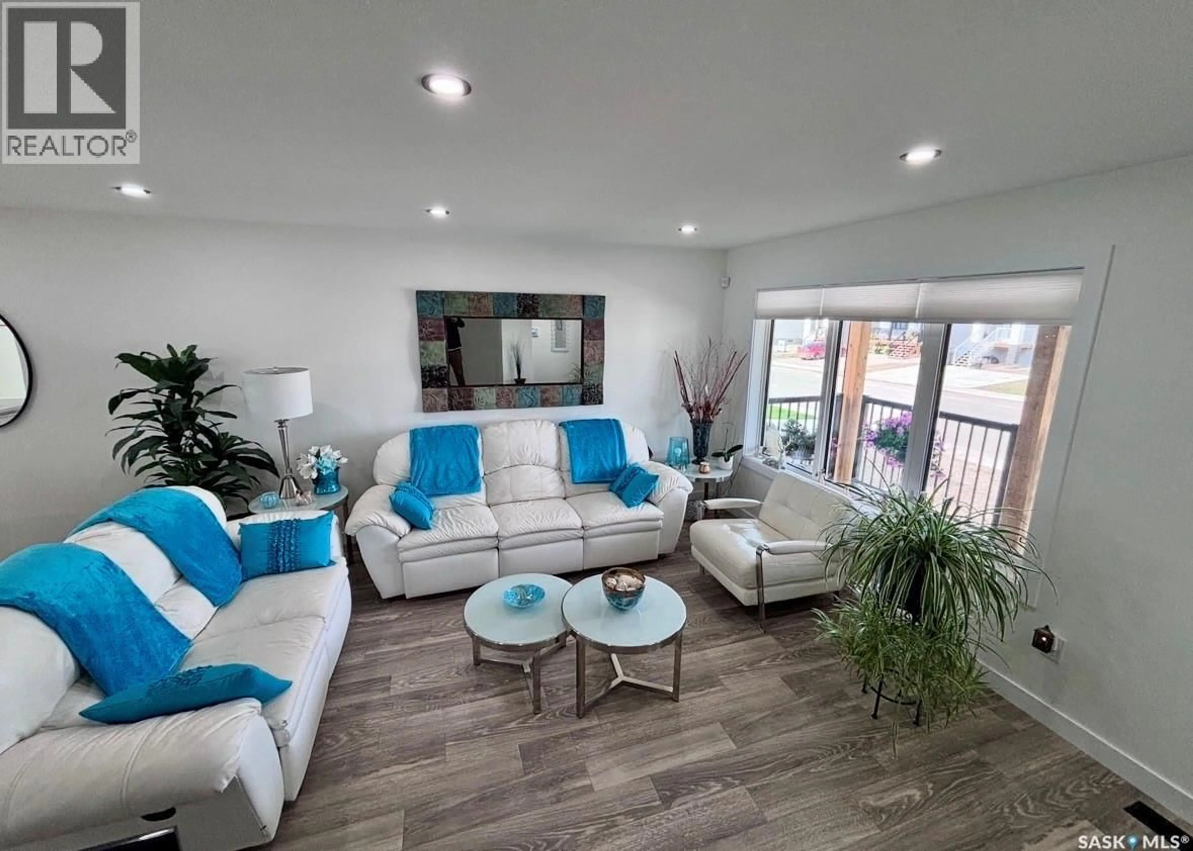 Living room with furniture, wood/laminate floor for 415 ELDORADO STREET, Warman Saskatchewan S0K4S0