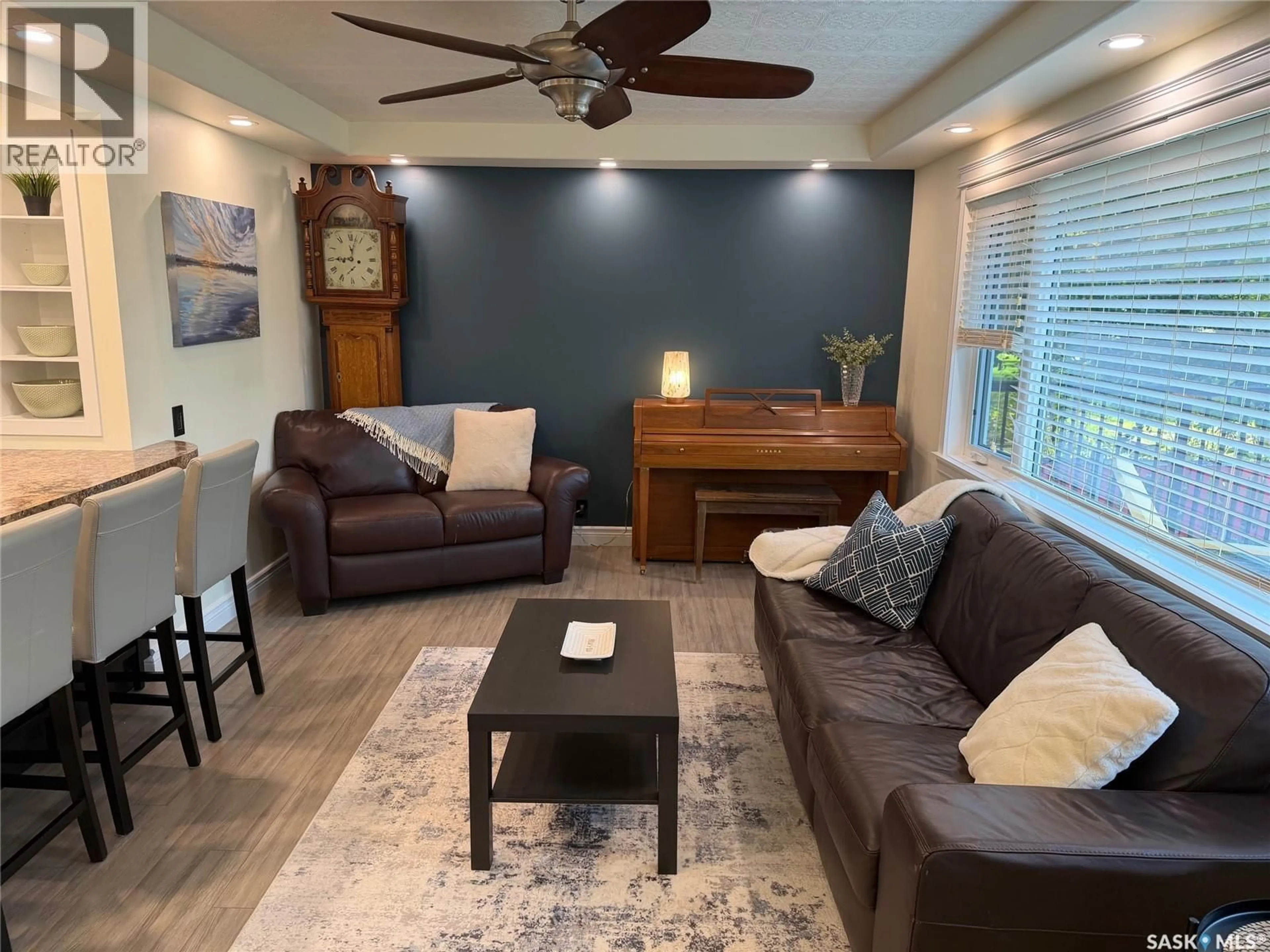 Living room with furniture, wood/laminate floor for 2217 LANSDOWNE AVENUE, Saskatoon Saskatchewan S7J1G7