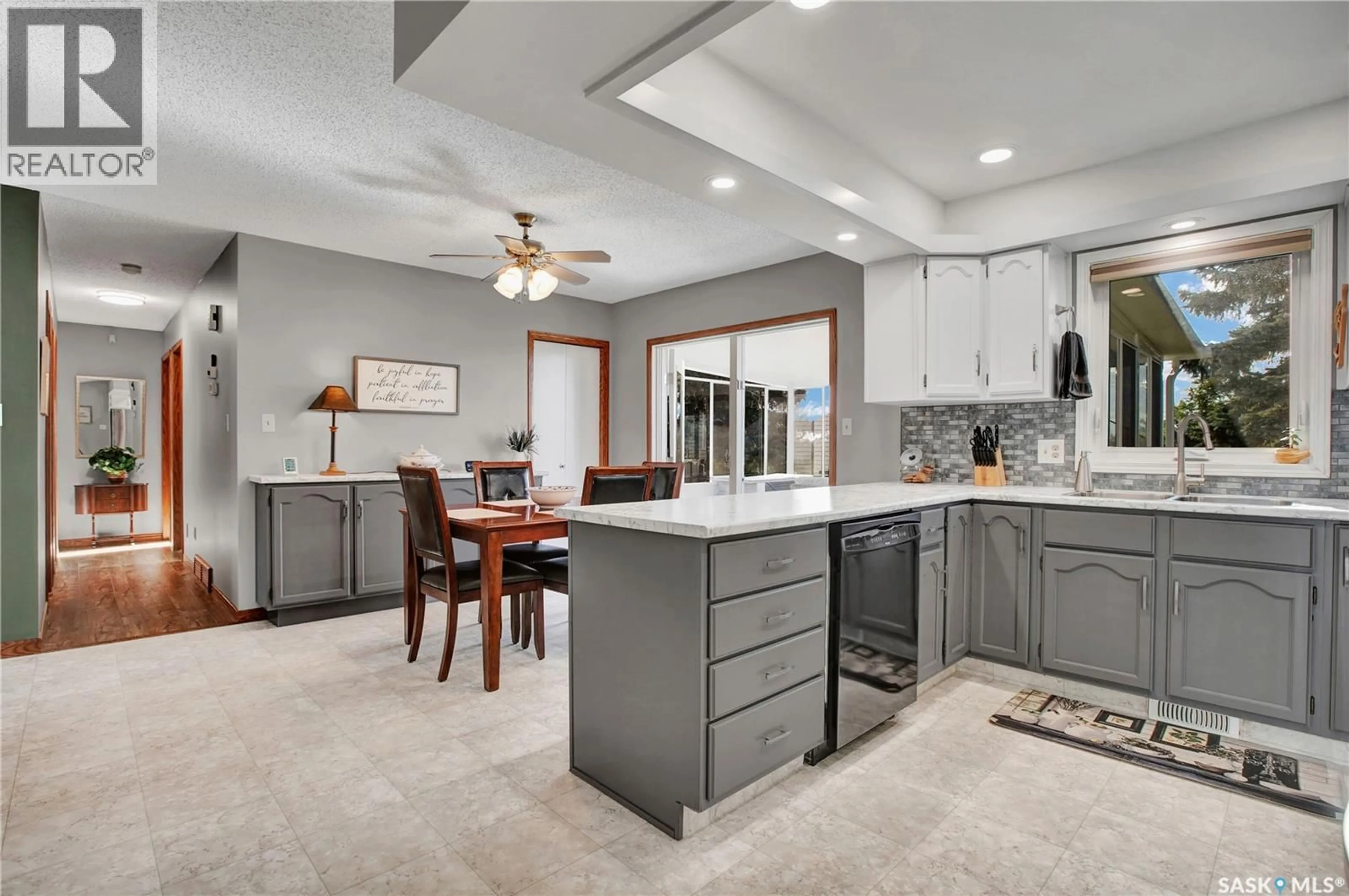 Open concept kitchen, ceramic/tile floor for 358 WAKAW CRESCENT, Saskatoon Saskatchewan S7J4E2