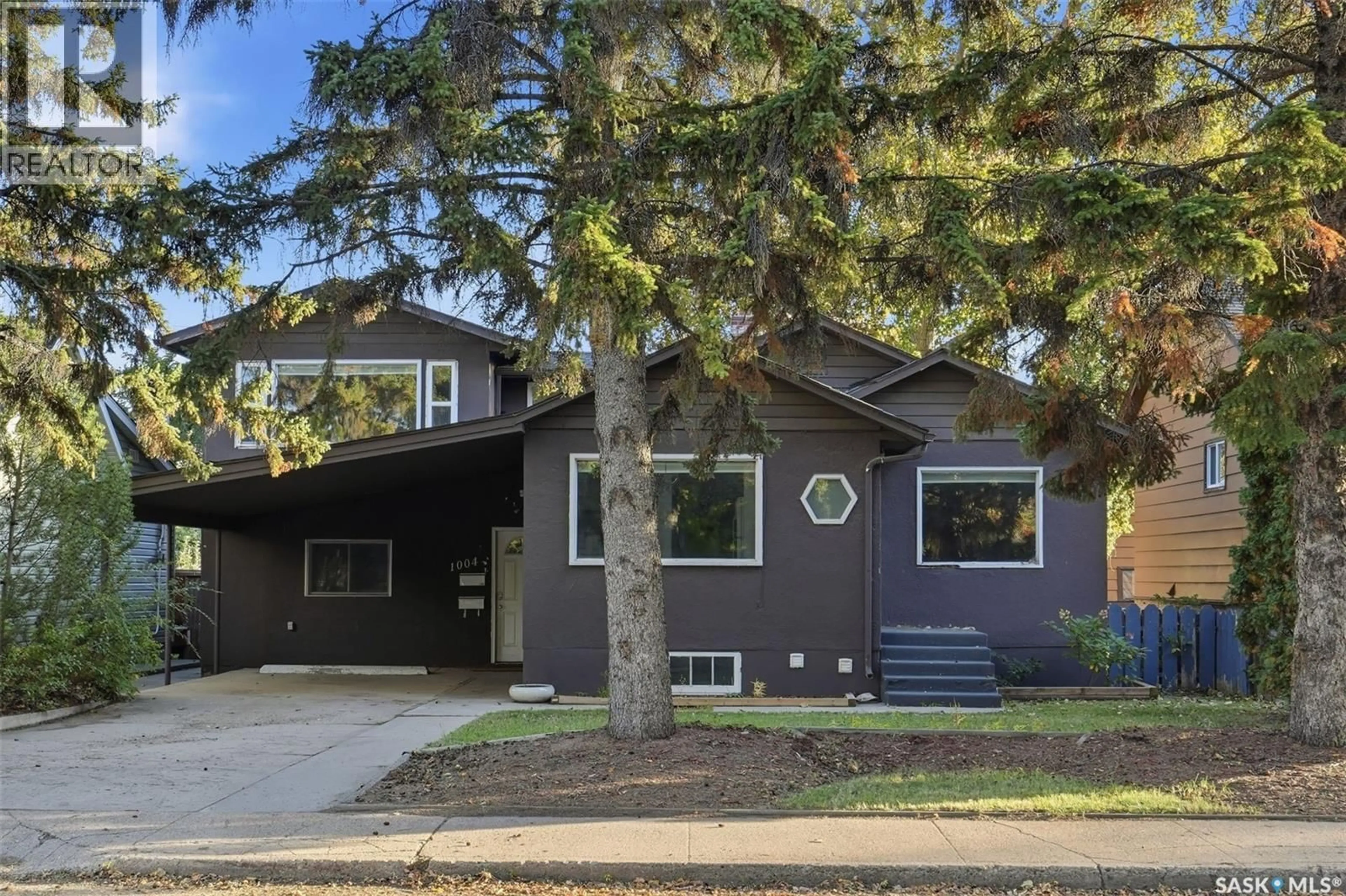 Home with vinyl exterior material, street for 1004 6TH STREET, Saskatoon Saskatchewan S7H1E2