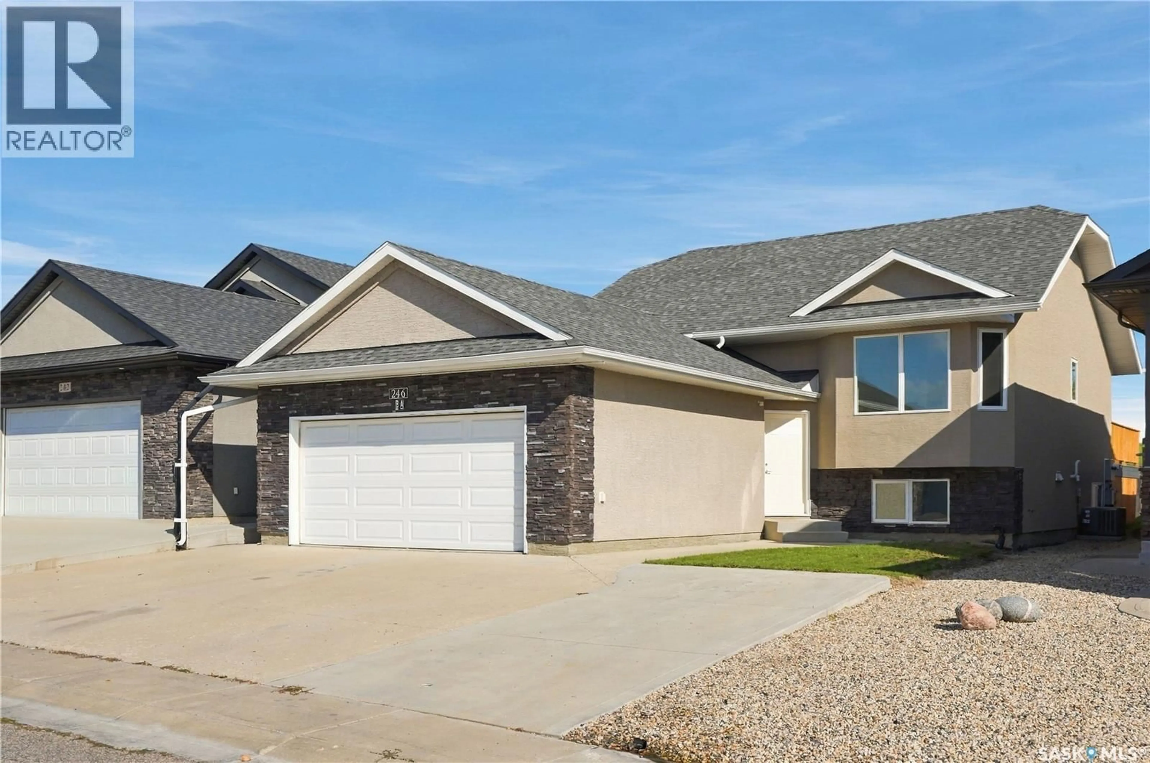 Home with vinyl exterior material, street for 246 SUTTER PLACE, Saskatoon Saskatchewan S7T0R3