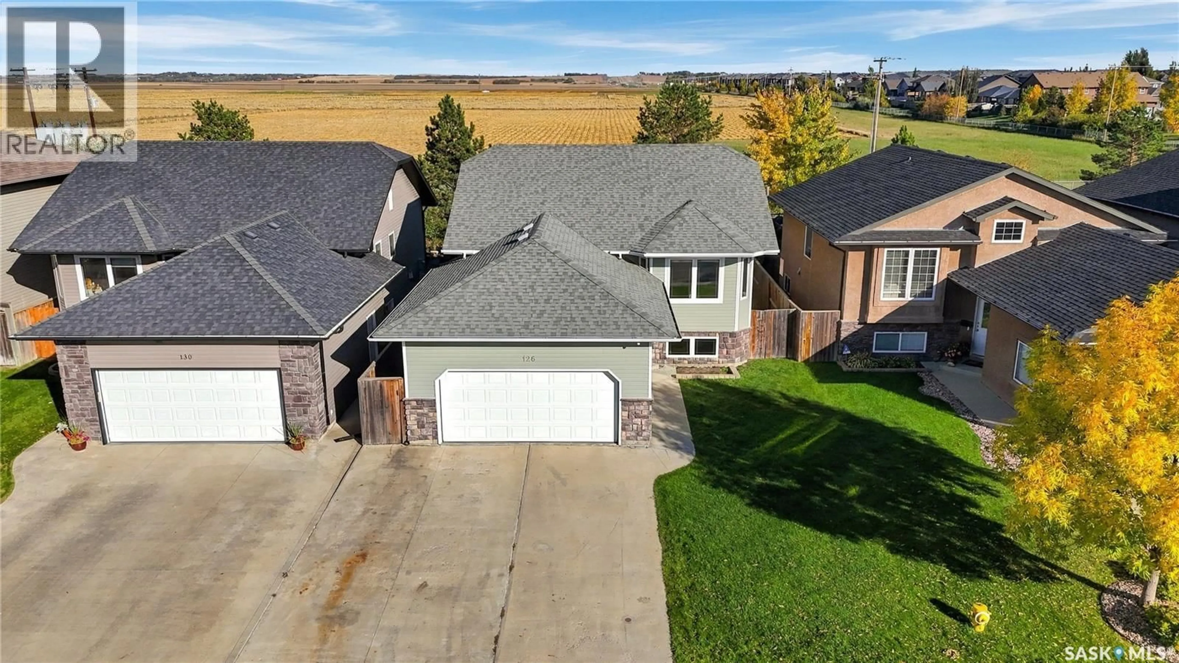 A pic from outside/outdoor area/front of a property/back of a property/a pic from drone, street for 126 LAMARSH ROAD, Saskatoon Saskatchewan S7W1B7