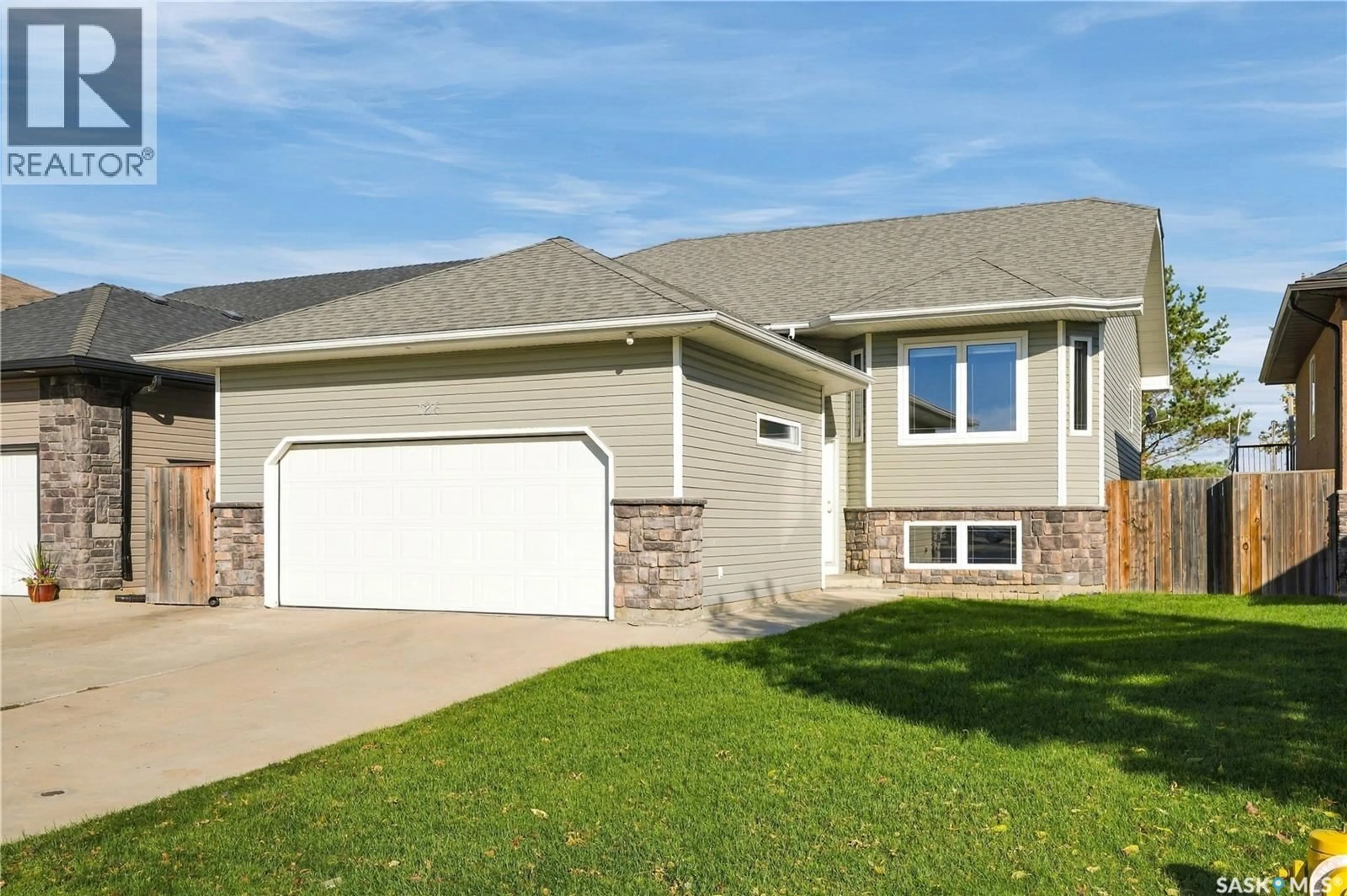 Home with vinyl exterior material, street for 126 LAMARSH ROAD, Saskatoon Saskatchewan S7W1B7