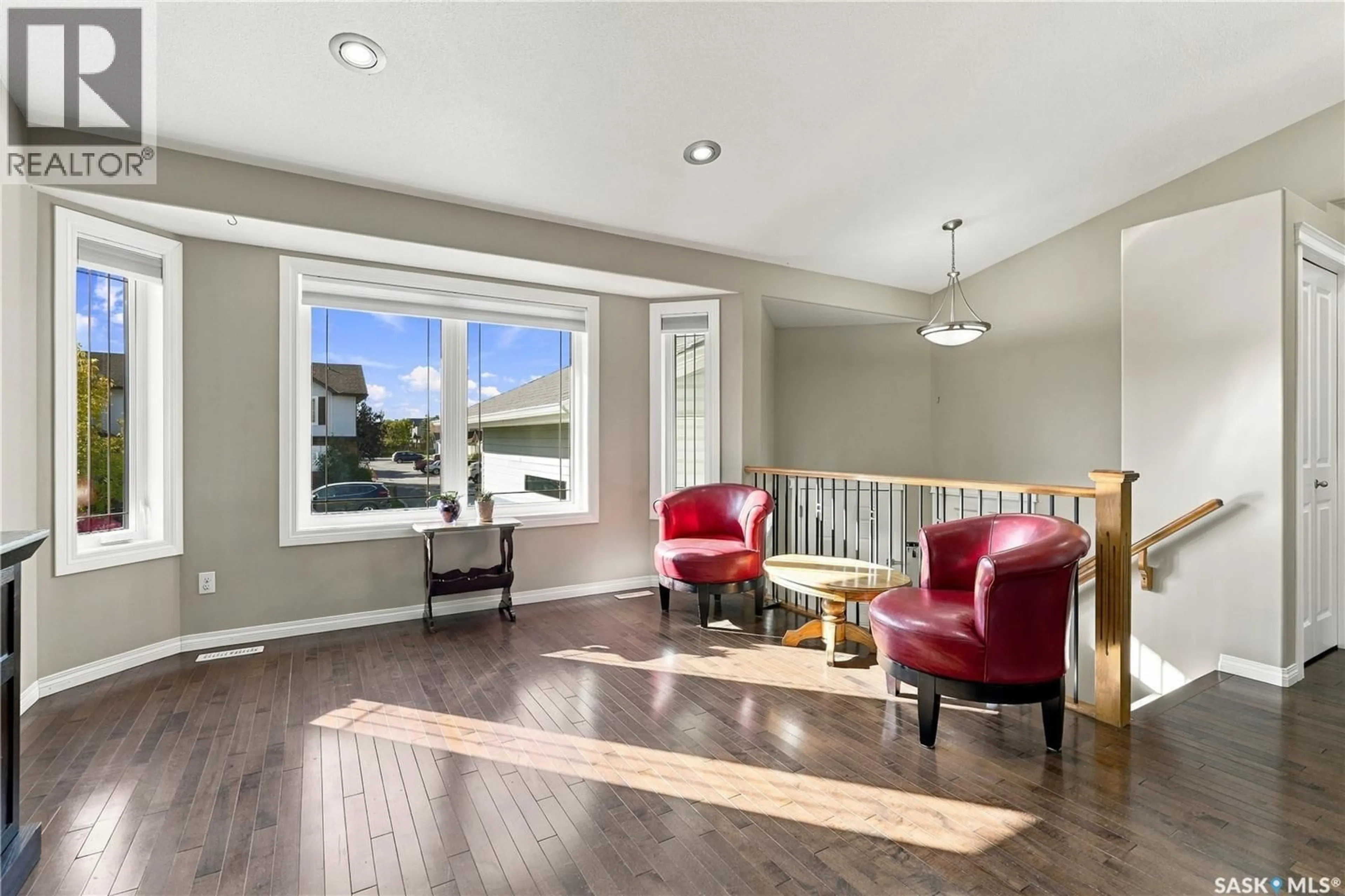 Living room with furniture, wood/laminate floor for 126 LAMARSH ROAD, Saskatoon Saskatchewan S7W1B7