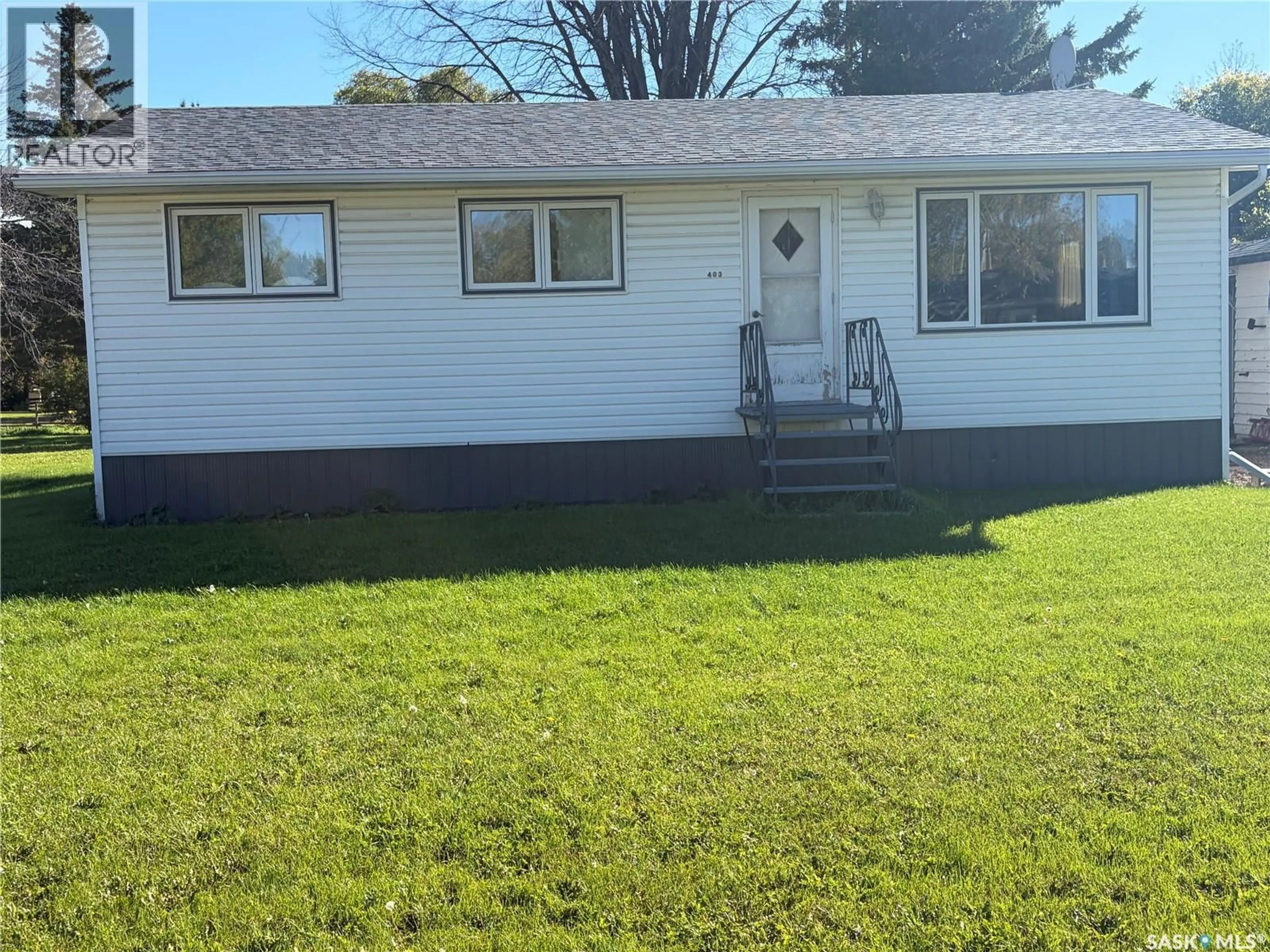 Home with vinyl exterior material, street for 403 & 401 MAIN STREET, Pelly Saskatchewan S0A2Z0