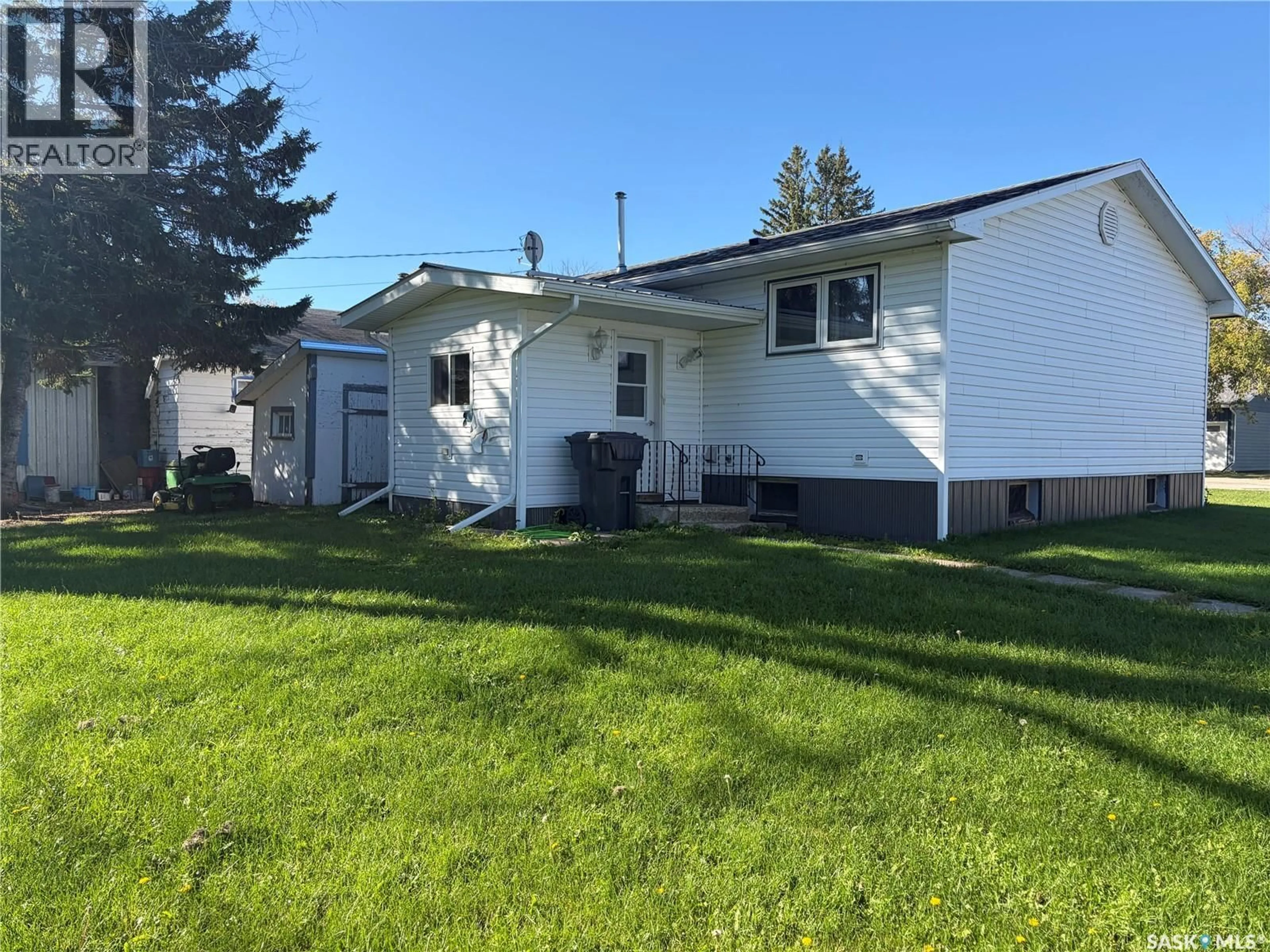Home with vinyl exterior material, street for 403 & 401 MAIN STREET, Pelly Saskatchewan S0A2Z0