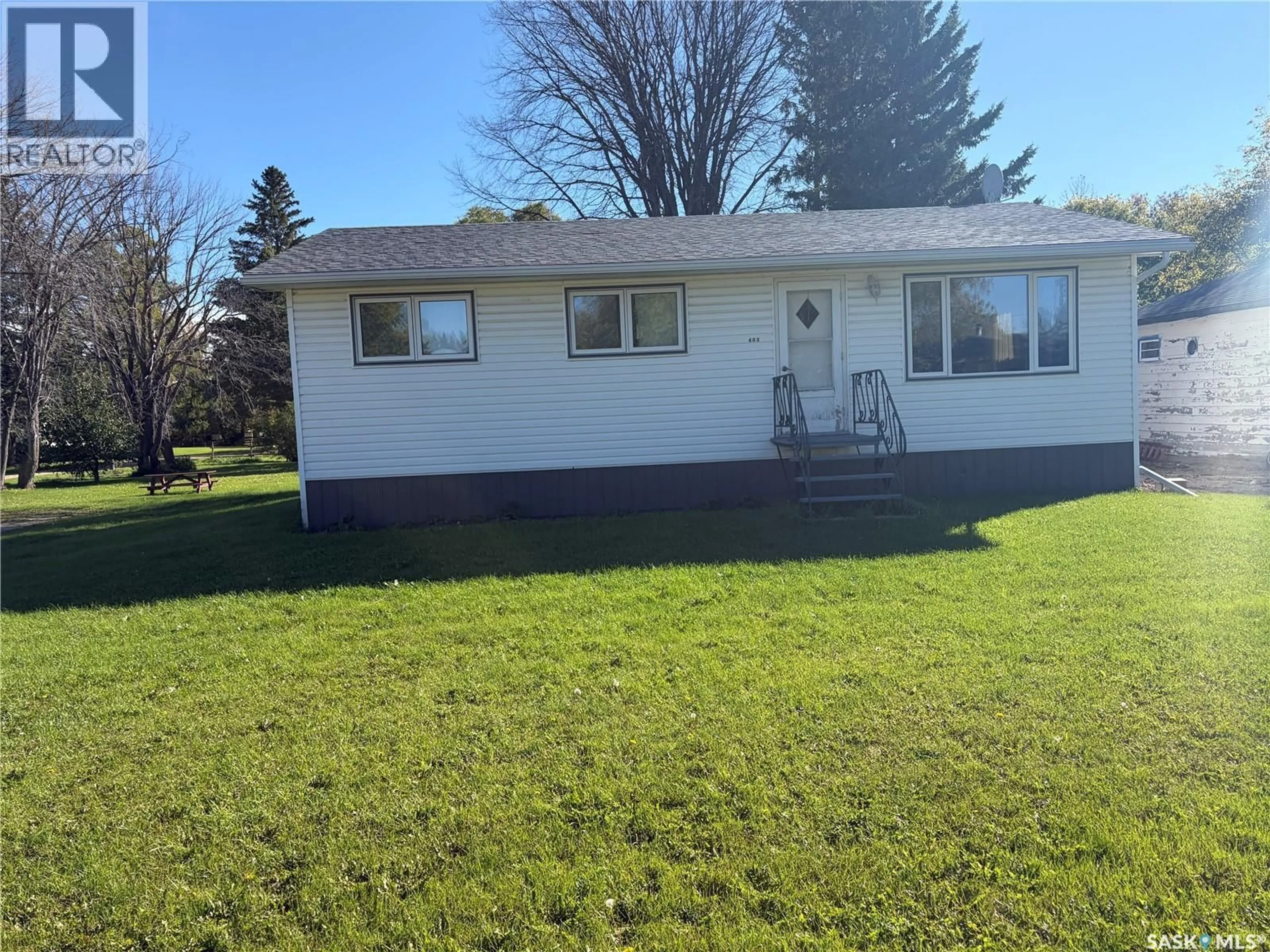 Home with vinyl exterior material, street for 403 & 401 MAIN STREET, Pelly Saskatchewan S0A2Z0
