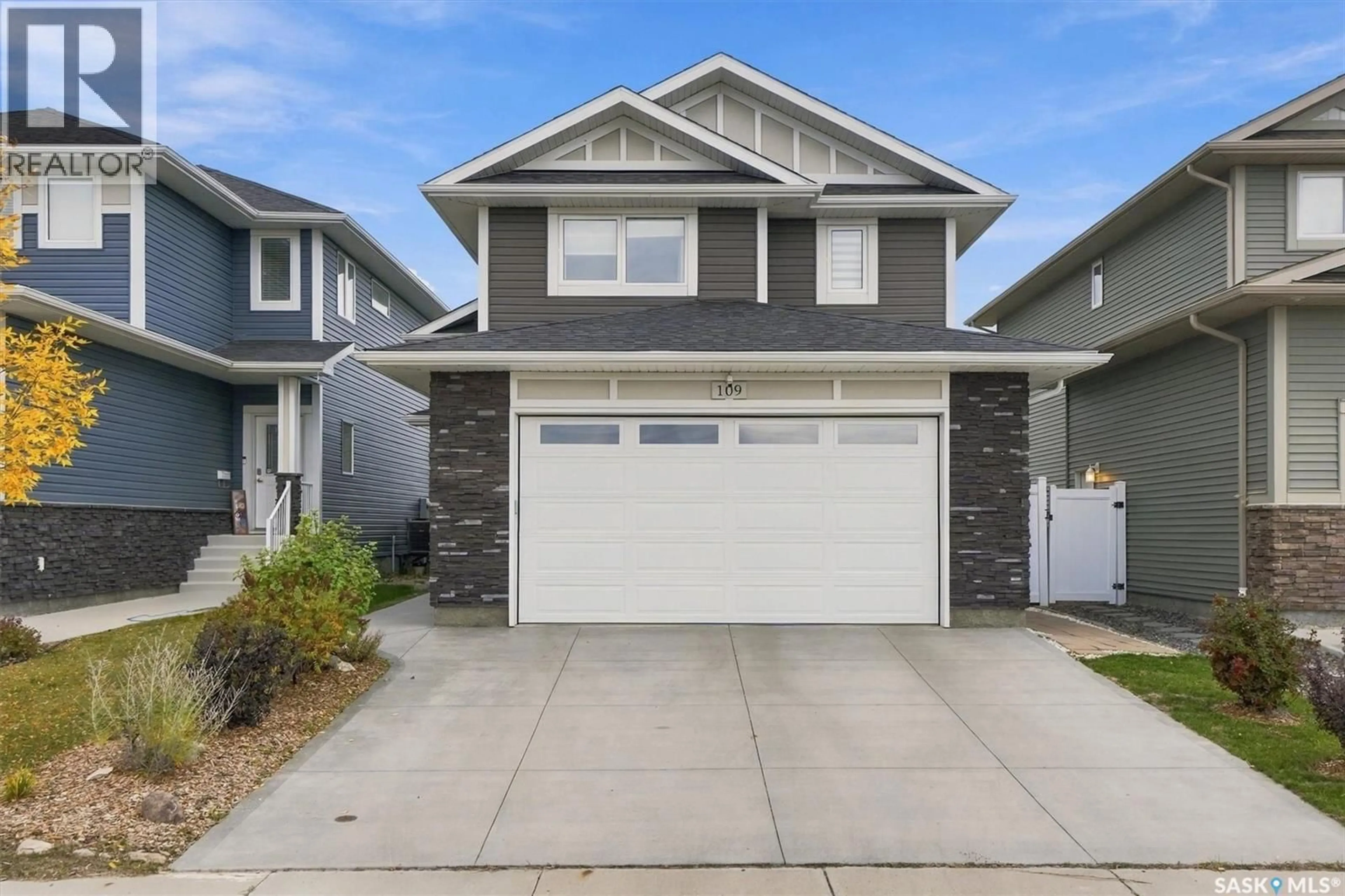 Home with vinyl exterior material, street for 109 COWAN CRESCENT, Martensville Saskatchewan S0K2T1
