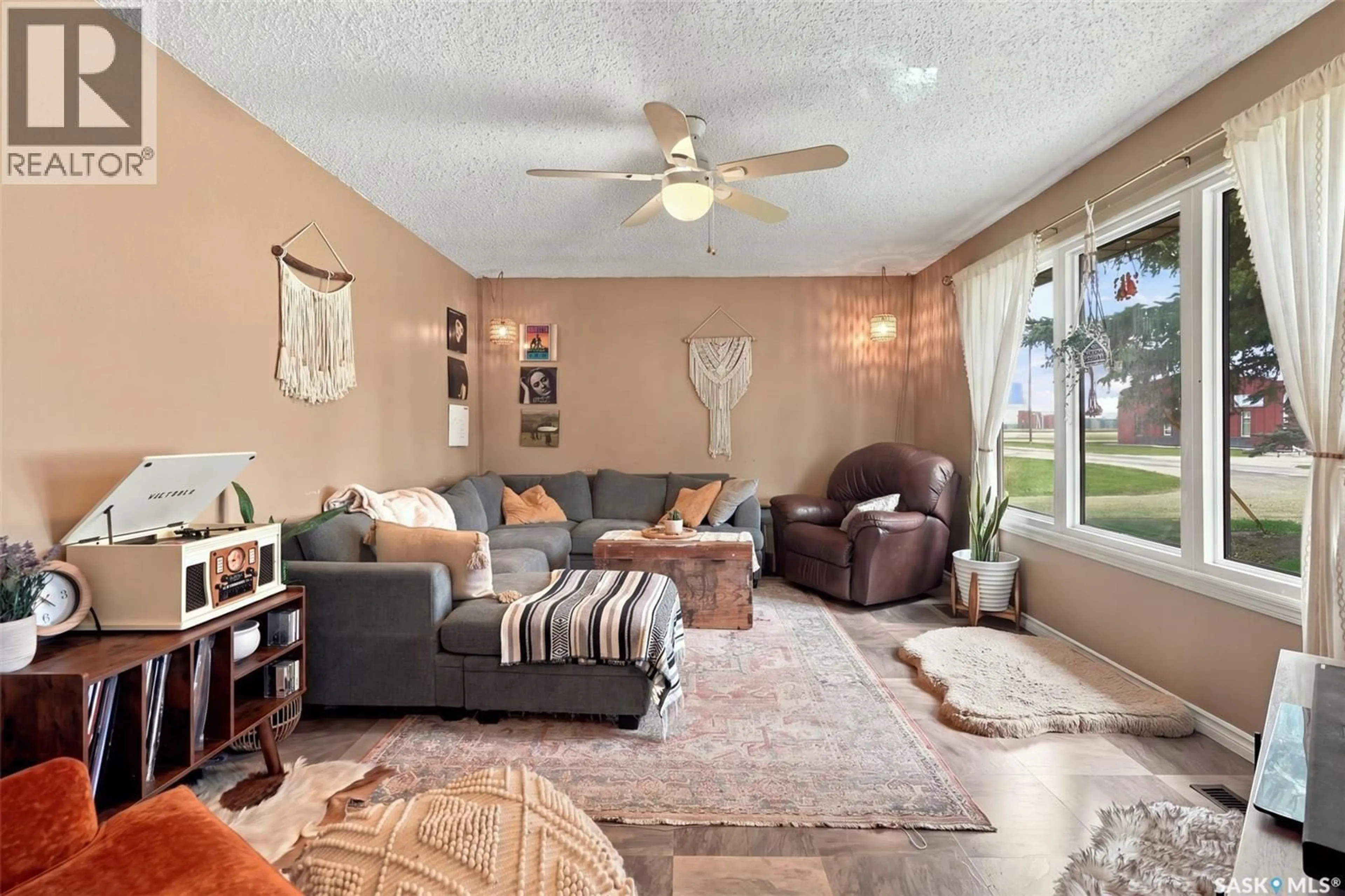 Living room with furniture, ceramic/tile floor for 116 BATES STREET, Earl Grey Saskatchewan S0G1J0