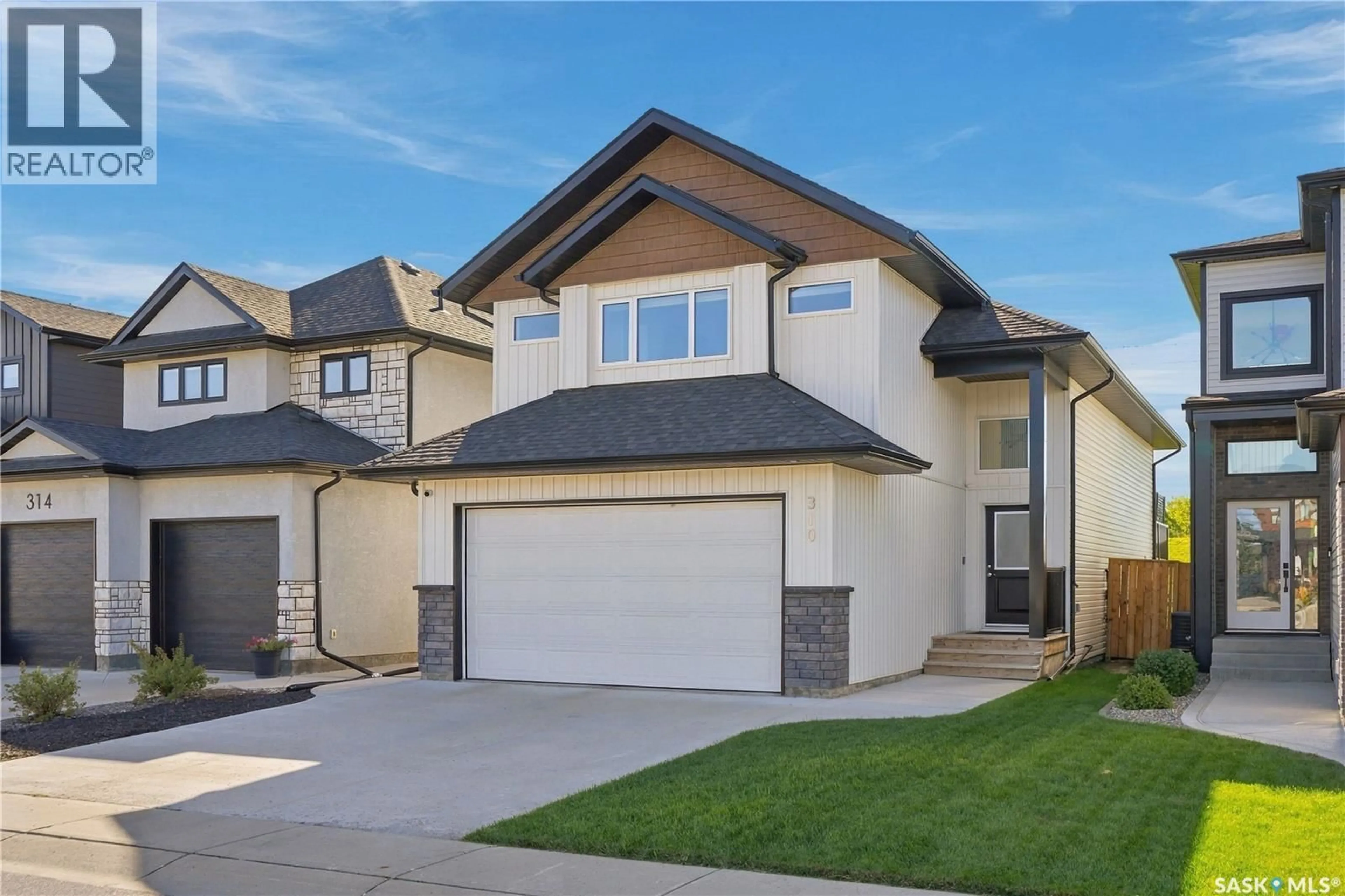 Home with vinyl exterior material, street for 310 BURGESS CRESCENT, Saskatoon Saskatchewan S7V0S3