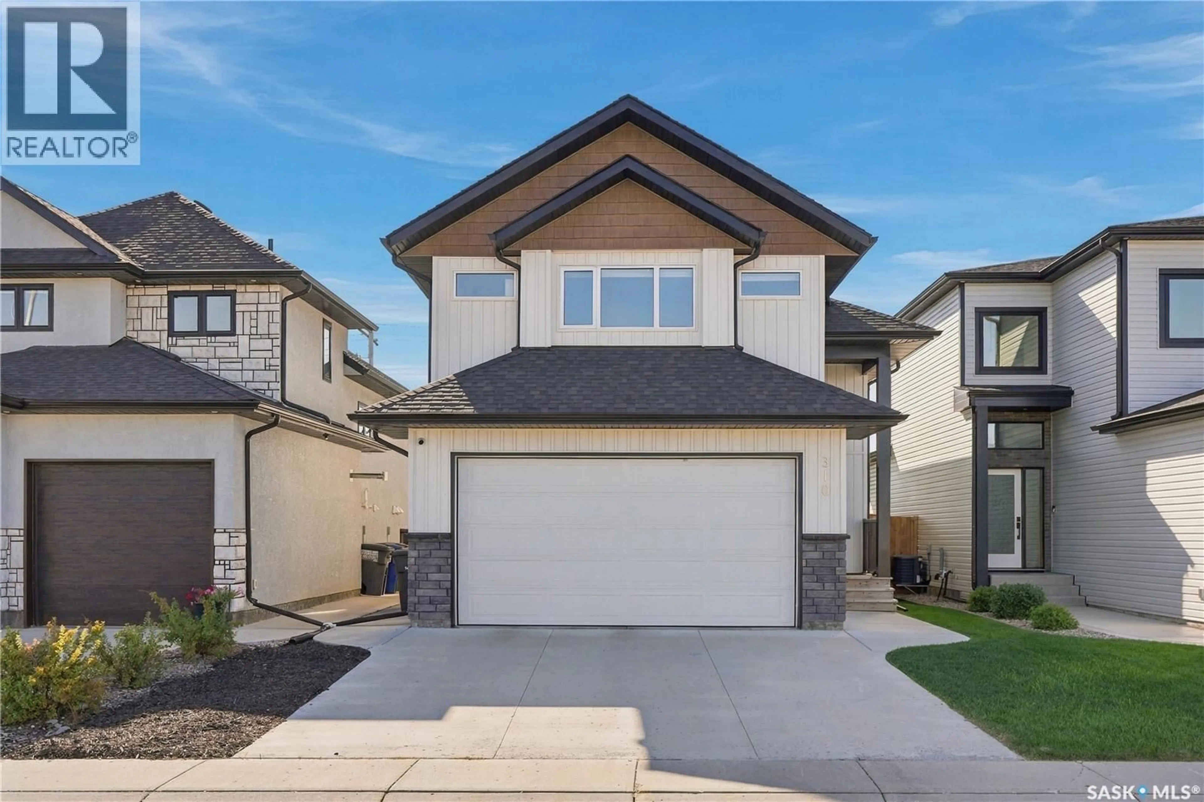 Home with vinyl exterior material, street for 310 BURGESS CRESCENT, Saskatoon Saskatchewan S7V0S3