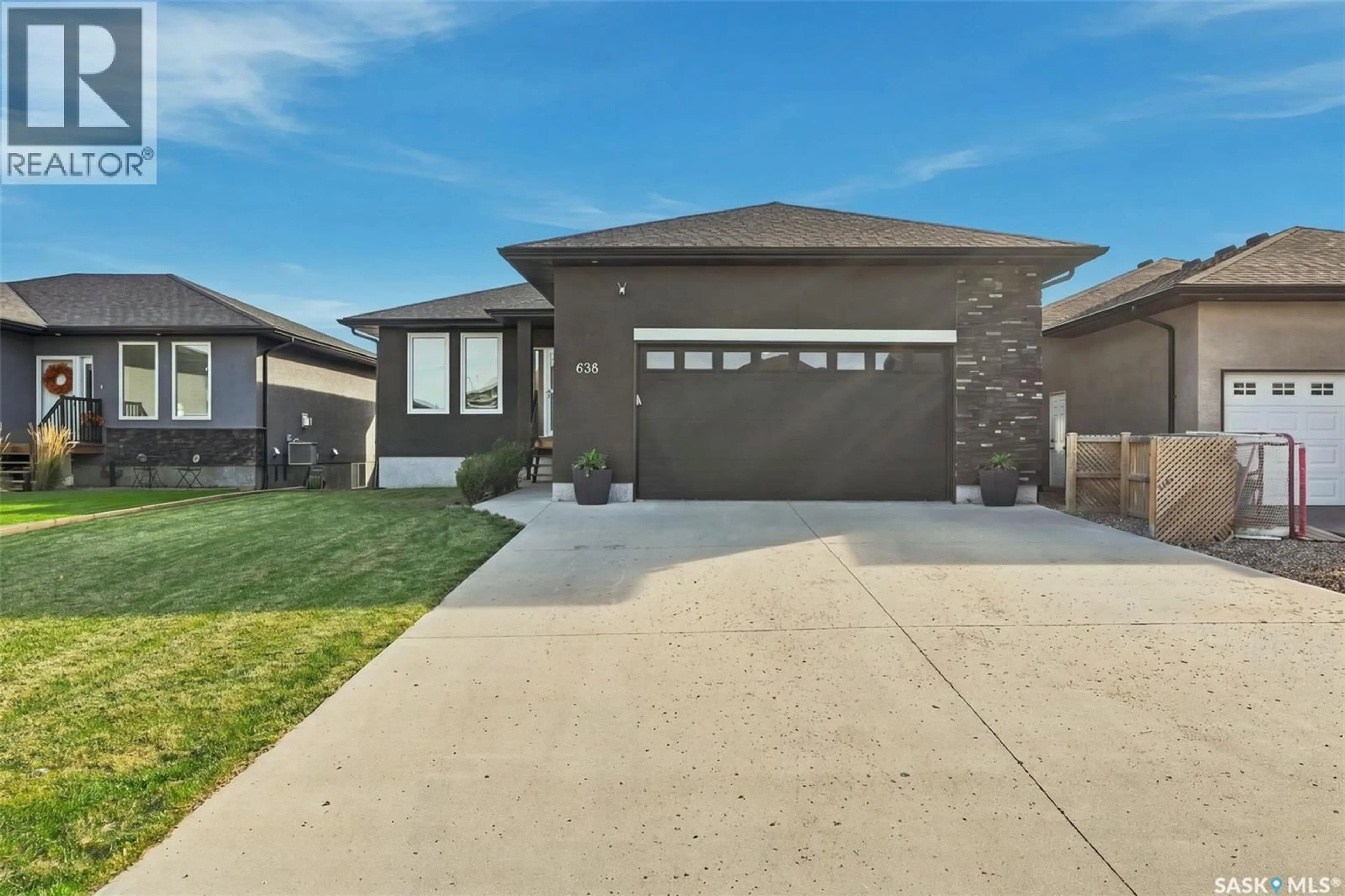 Home with brick exterior material, street for 638 ASPEN CRESCENT, Pilot Butte Saskatchewan S0G3Z0