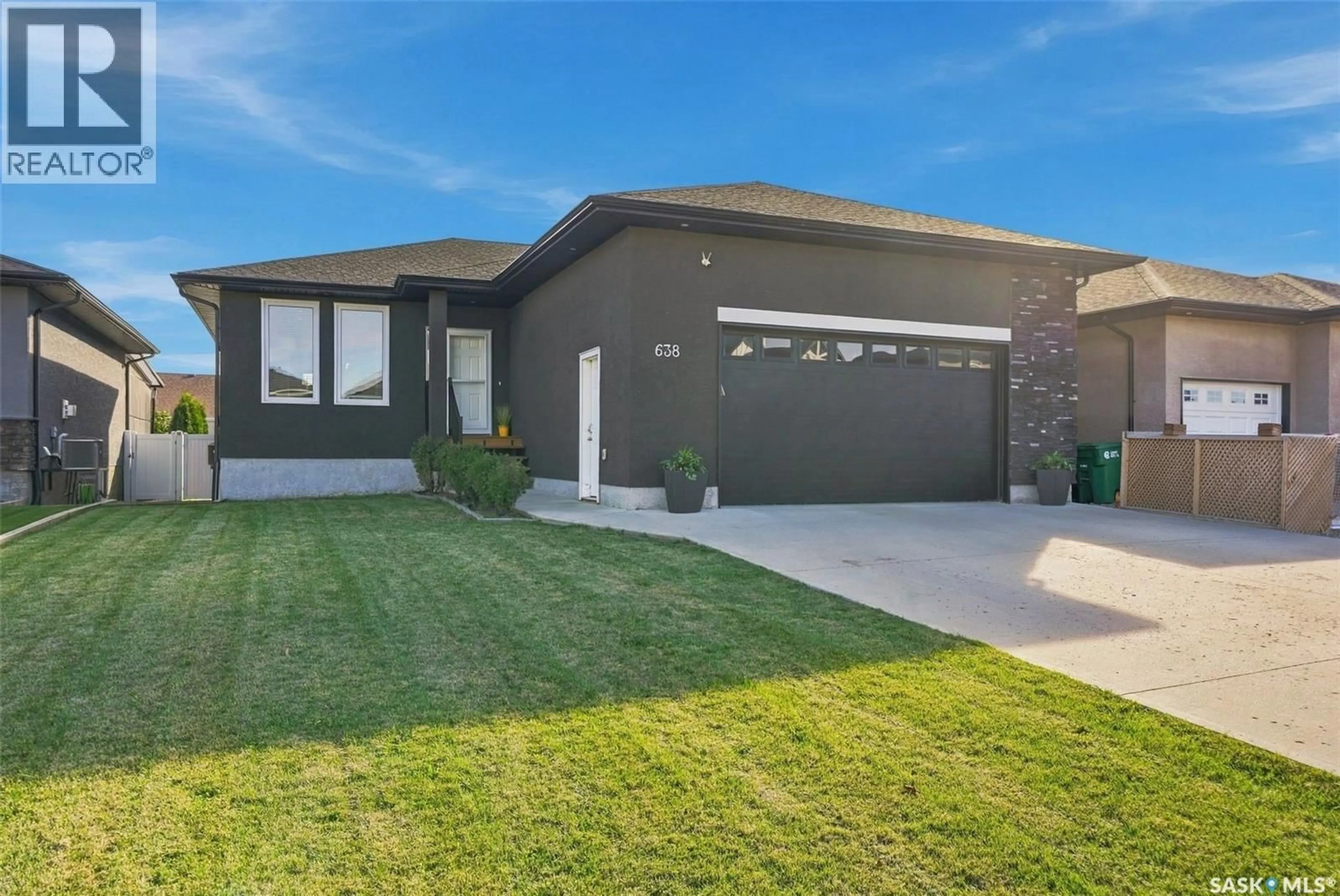 Home with brick exterior material, street for 638 ASPEN CRESCENT, Pilot Butte Saskatchewan S0G3Z0