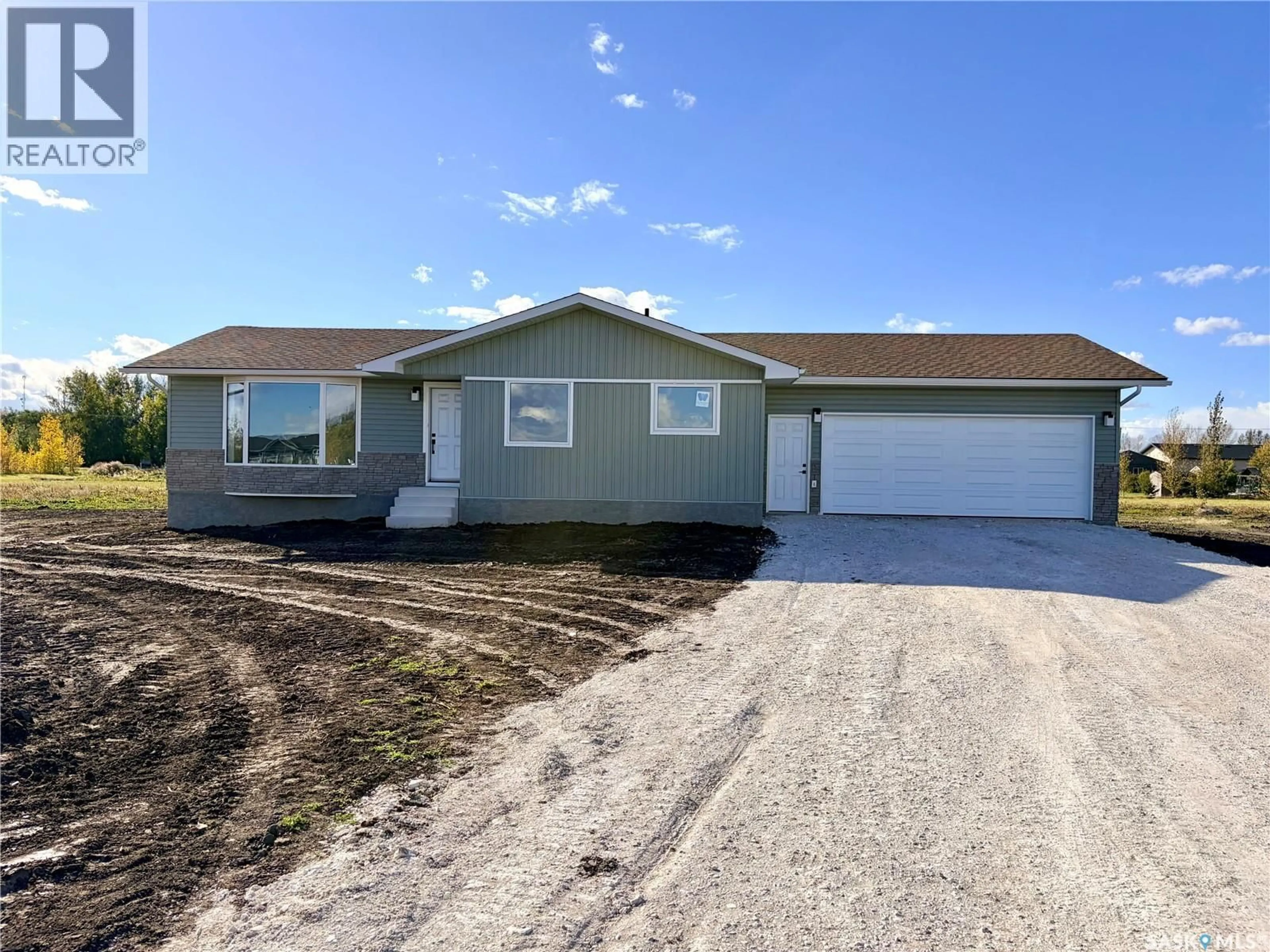 Home with vinyl exterior material, street for 38 HERITAGE COVE, Rosthern Rm No. 403 Saskatchewan S0K1X1