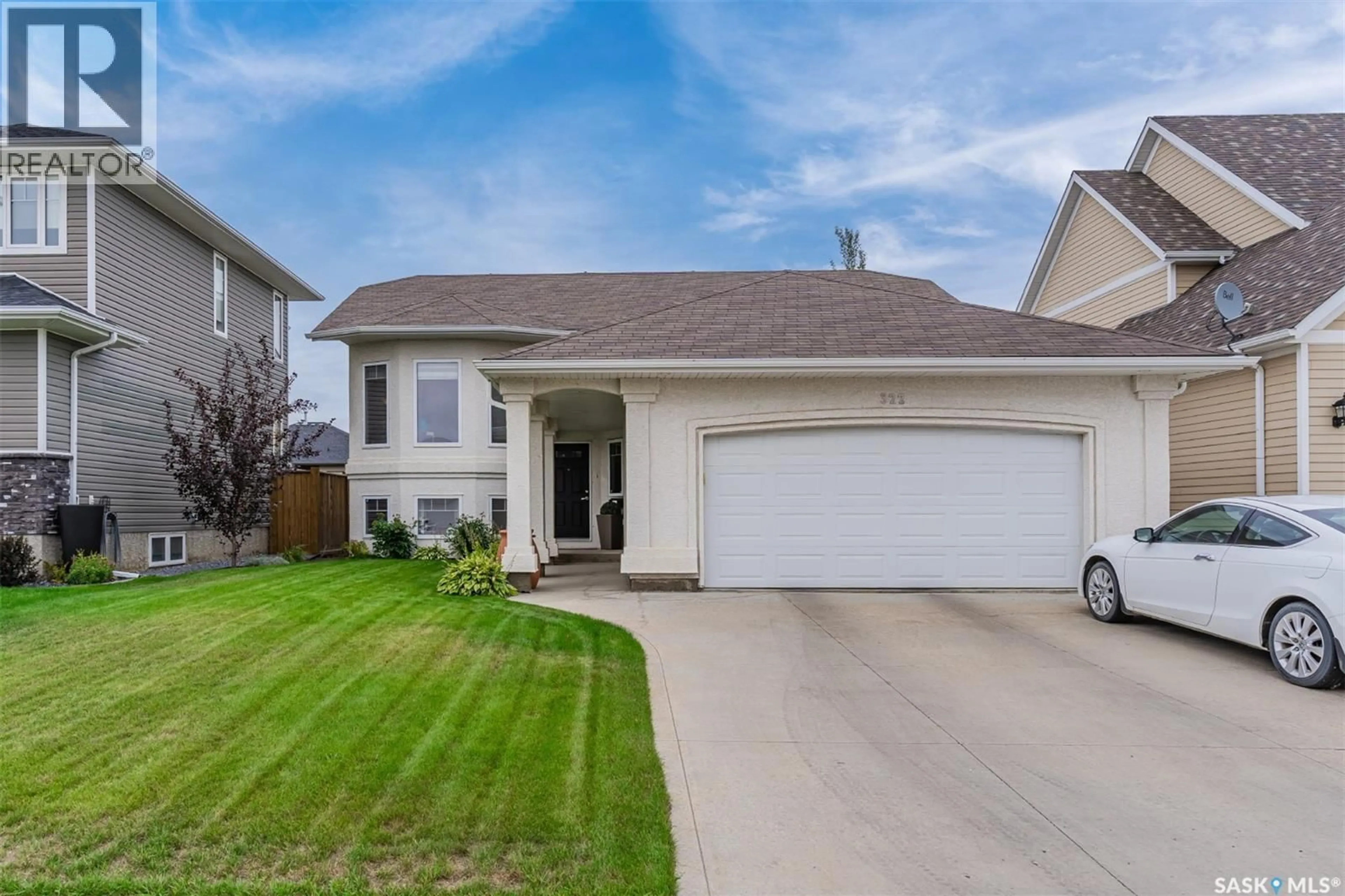 Home with vinyl exterior material, street for 322 NICKLAUS DRIVE, Warman Saskatchewan S0K0A1