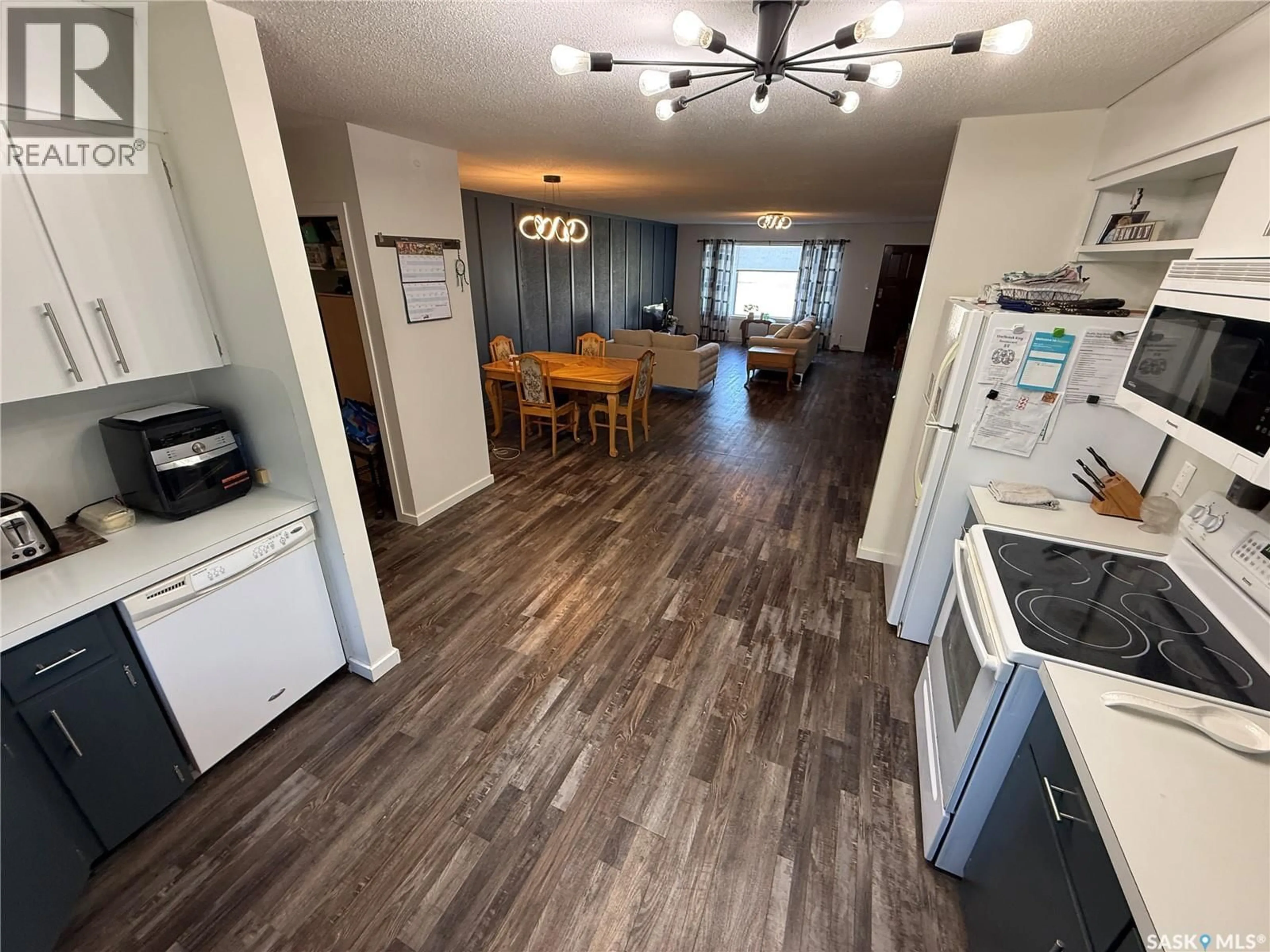 Open concept kitchen, wood/laminate floor for 4 PEPPER PLACE, Shellbrook Saskatchewan S0J2E0