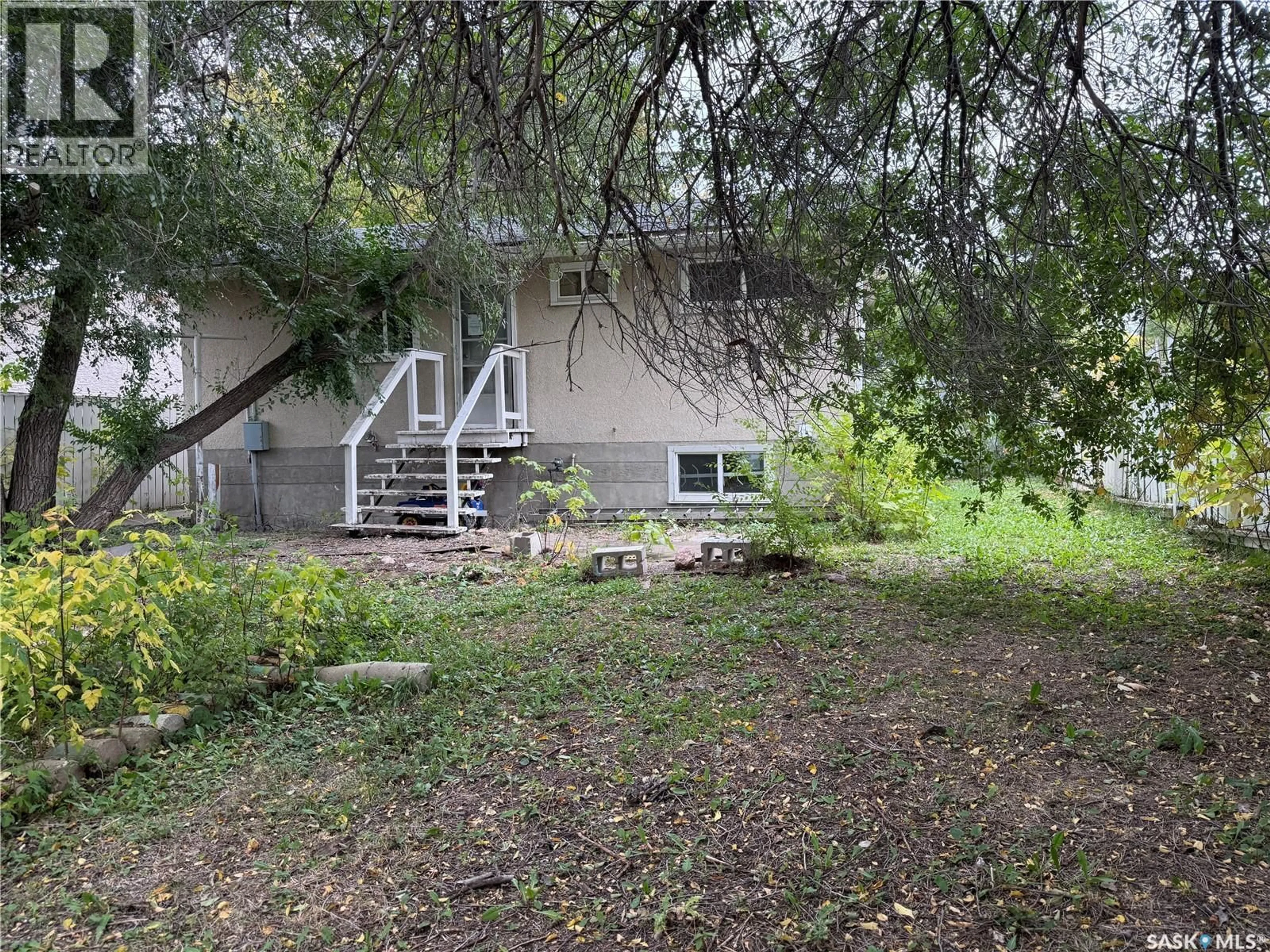 A pic from outside/outdoor area/front of a property/back of a property/a pic from drone, forest/trees view for 100 MARSHALL CRESCENT, Regina Saskatchewan S4R4Y9
