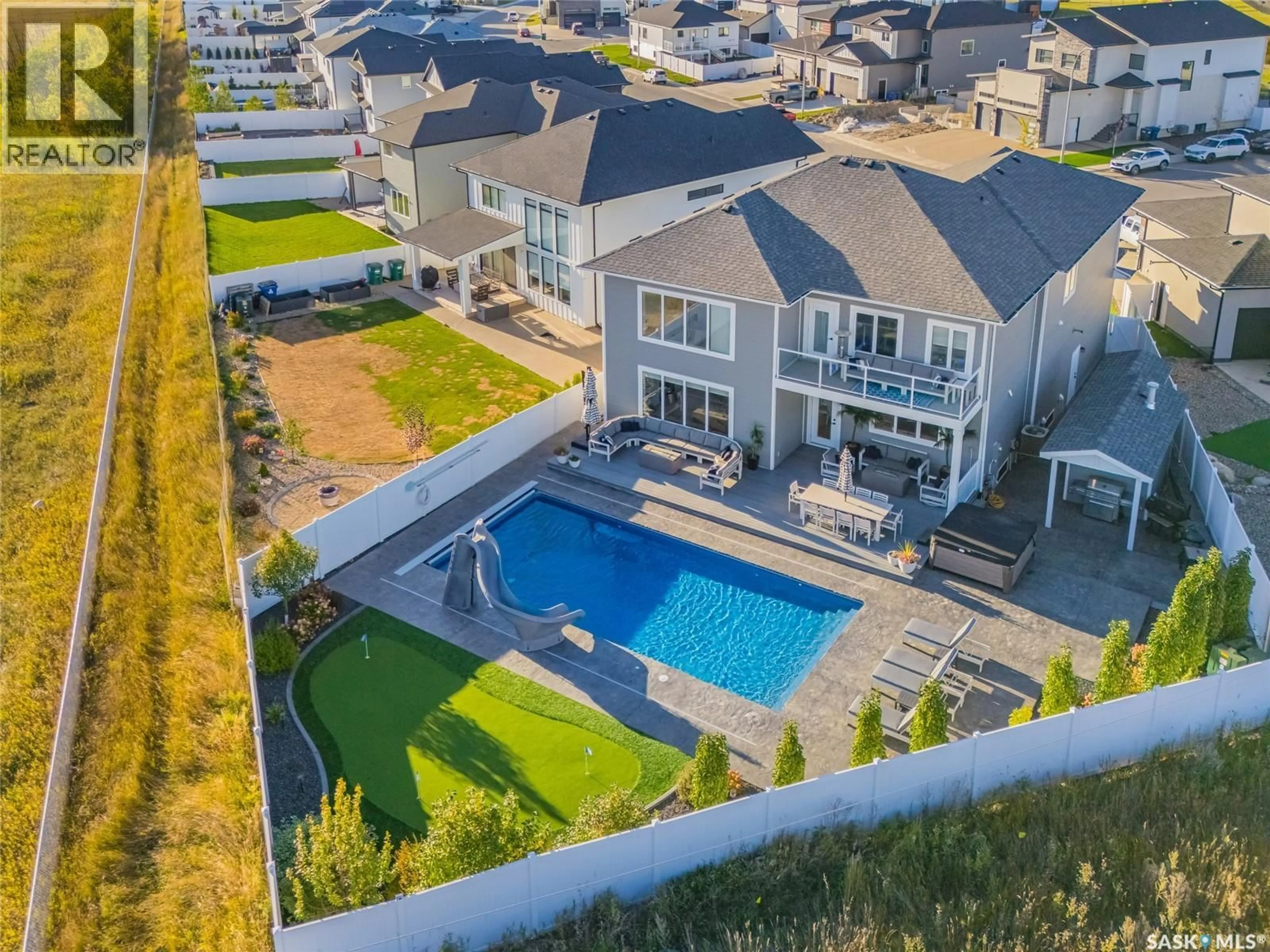 A pic from outside/outdoor area/front of a property/back of a property/a pic from drone, water/lake/river/ocean view for 464 WOOLF BEND, Saskatoon Saskatchewan S7W1E4