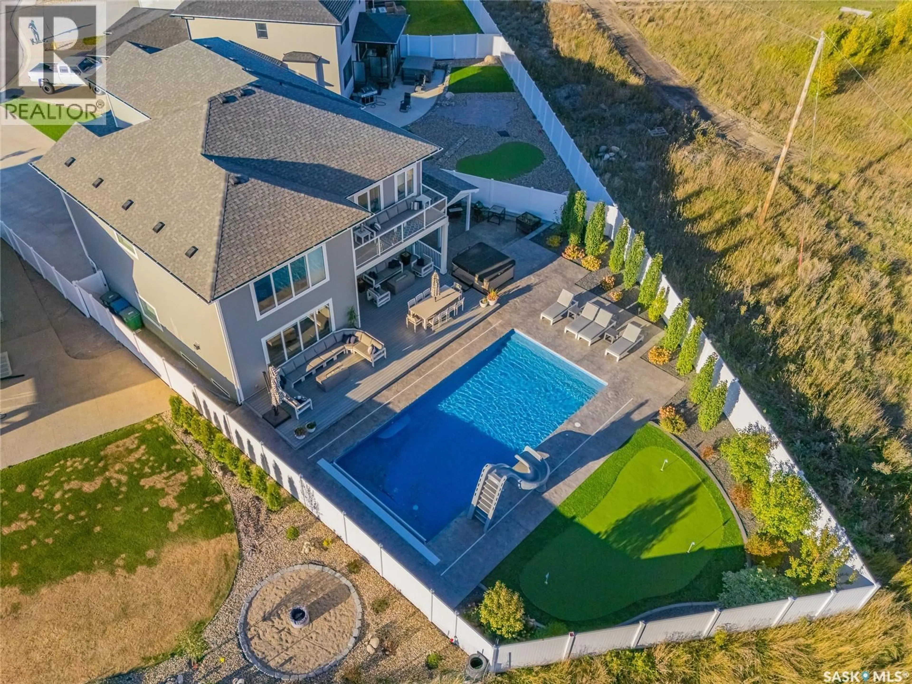 A pic from outside/outdoor area/front of a property/back of a property/a pic from drone, water/lake/river/ocean view for 464 WOOLF BEND, Saskatoon Saskatchewan S7W1E4