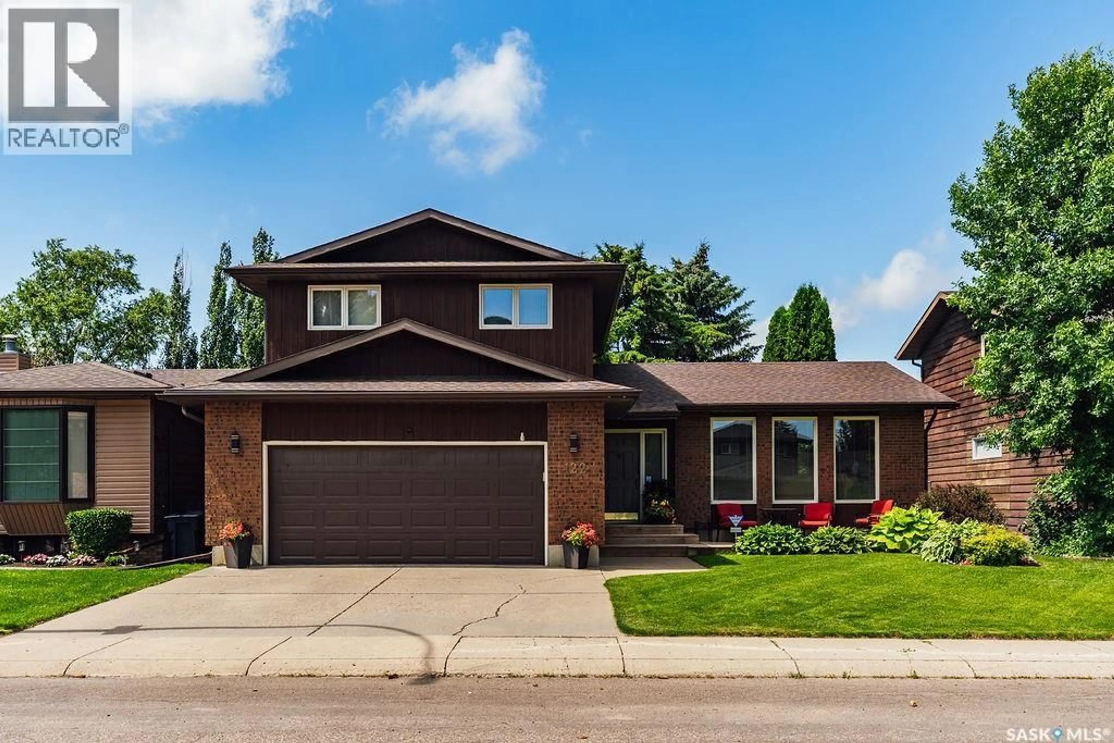 Home with brick exterior material, street for 122 WAKAW CRESCENT, Saskatoon Saskatchewan S7J4E2