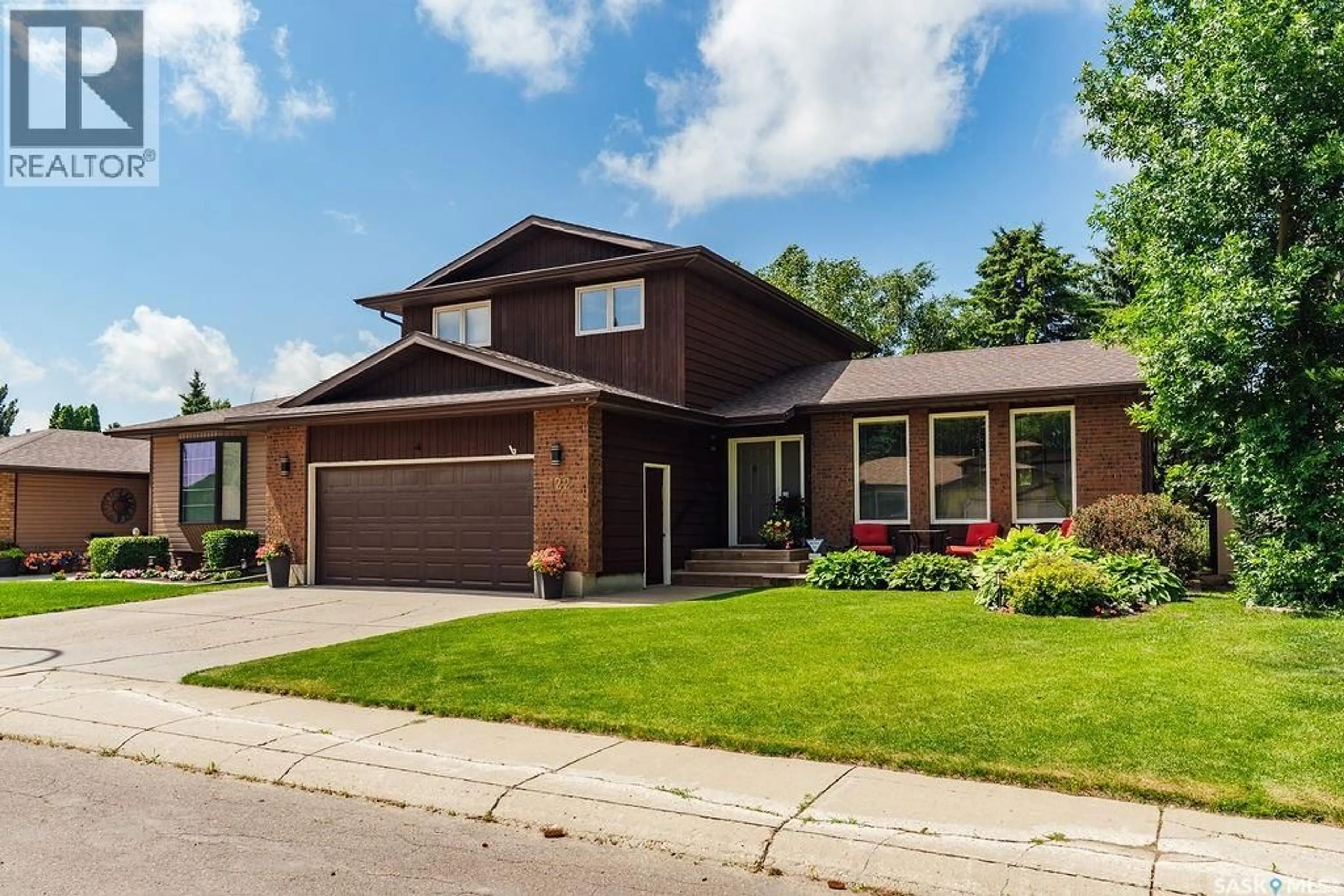 Home with brick exterior material, street for 122 WAKAW CRESCENT, Saskatoon Saskatchewan S7J4E2