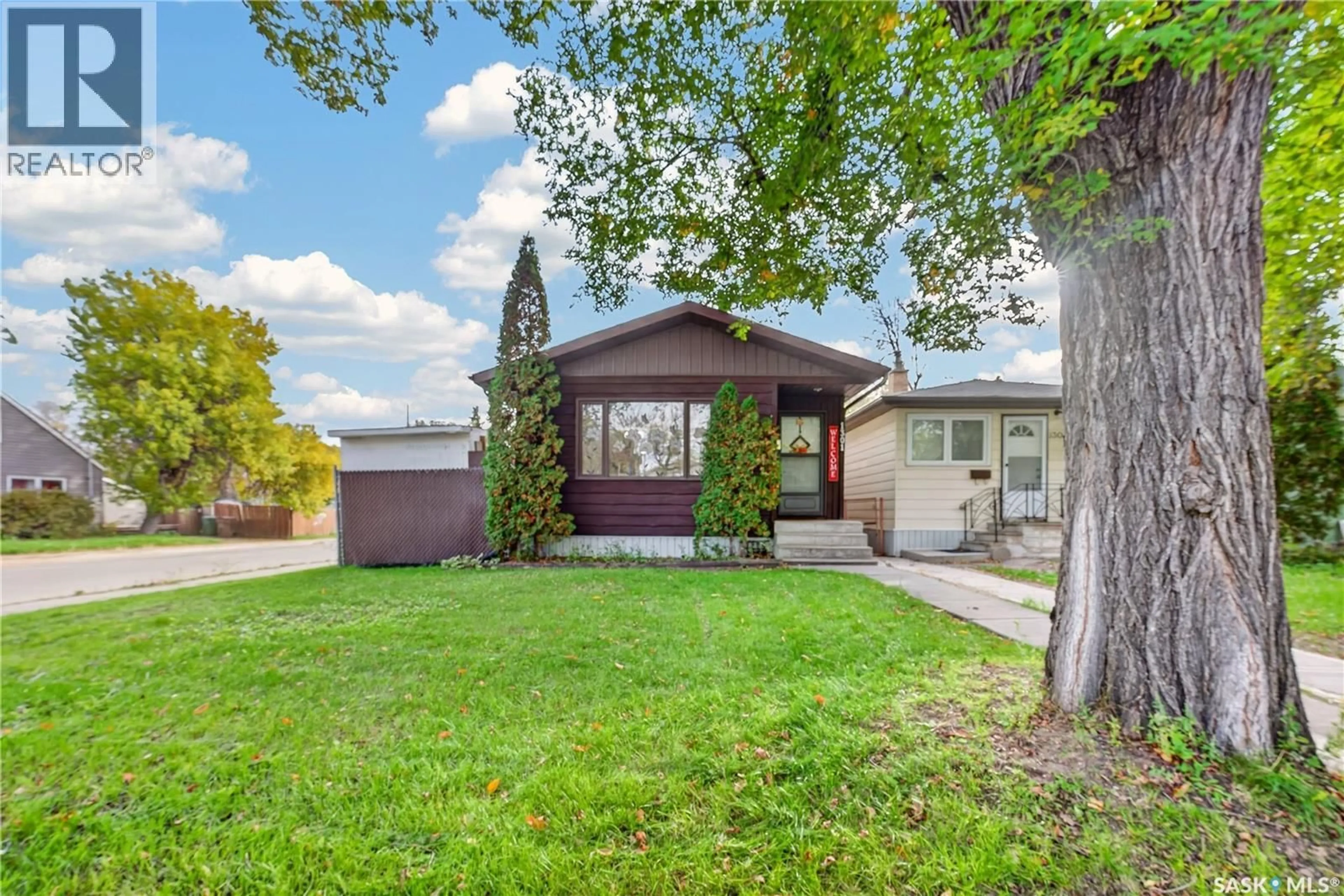 Home with vinyl exterior material, street for 1301 KING STREET, Regina Saskatchewan S4T4G3