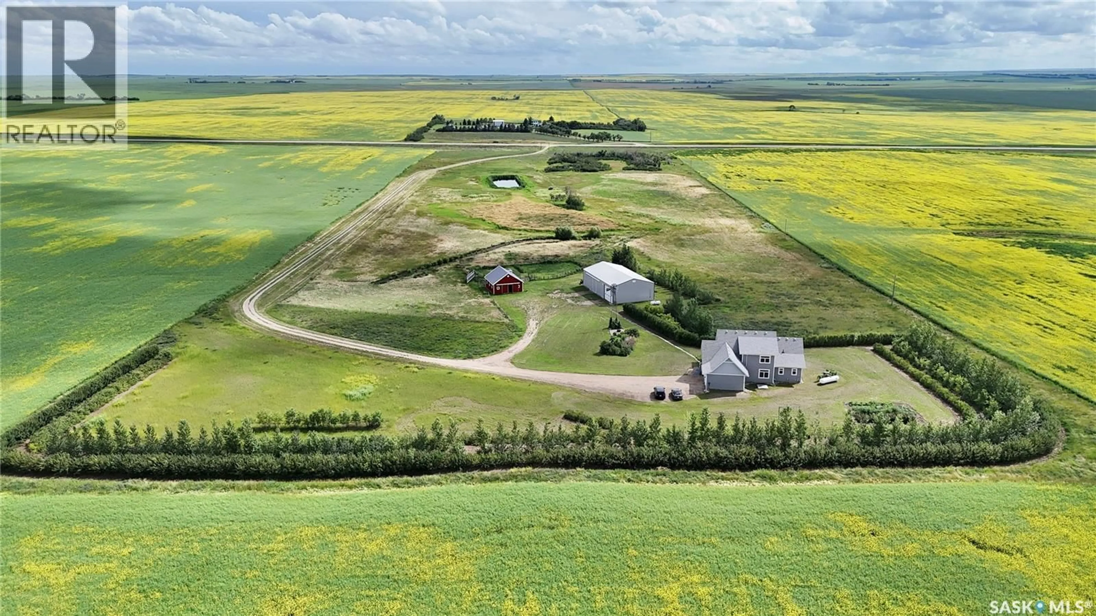 A pic from outside/outdoor area/front of a property/back of a property/a pic from drone, unknown for 15 HIGHWAY ACREAGE, Rudy Rm No. 284 Saskatchewan S0L2N0