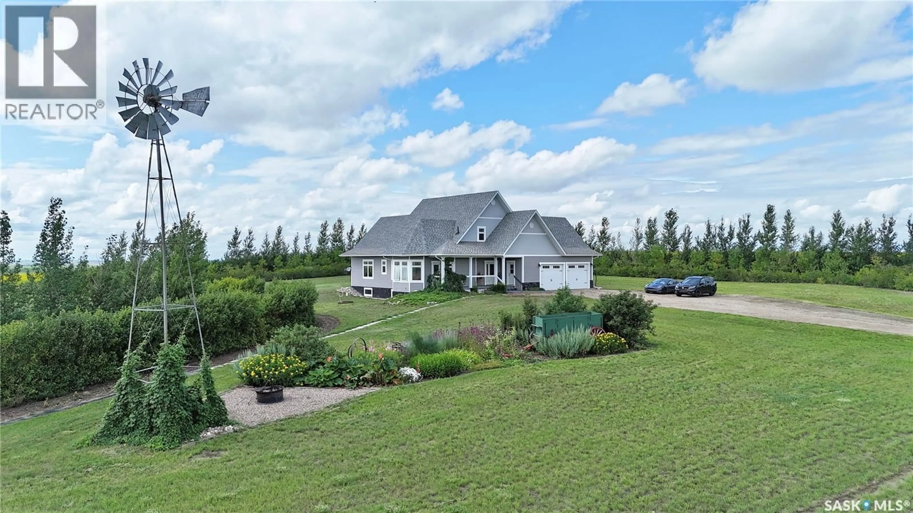 A pic from outside/outdoor area/front of a property/back of a property/a pic from drone, water/lake/river/ocean view for 15 HIGHWAY ACREAGE, Rudy Rm No. 284 Saskatchewan S0L2N0