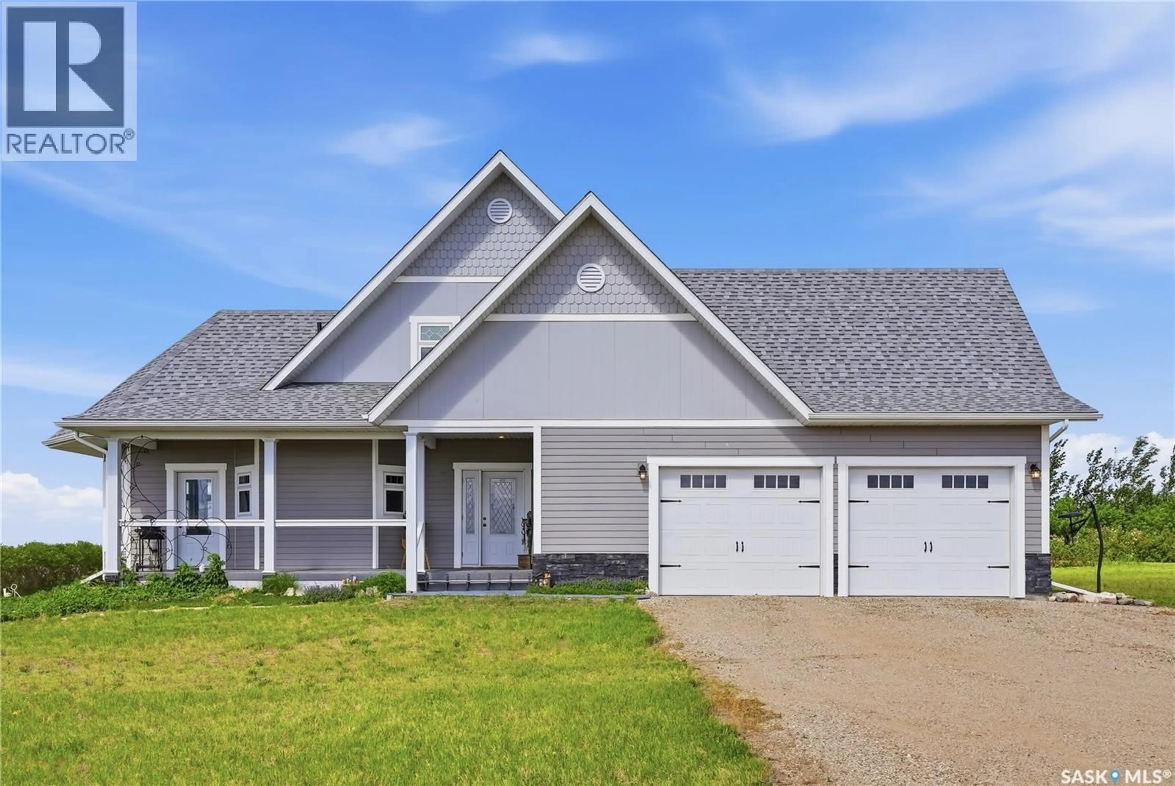 Home with vinyl exterior material, street for 15 HIGHWAY ACREAGE, Rudy Rm No. 284 Saskatchewan S0L2N0