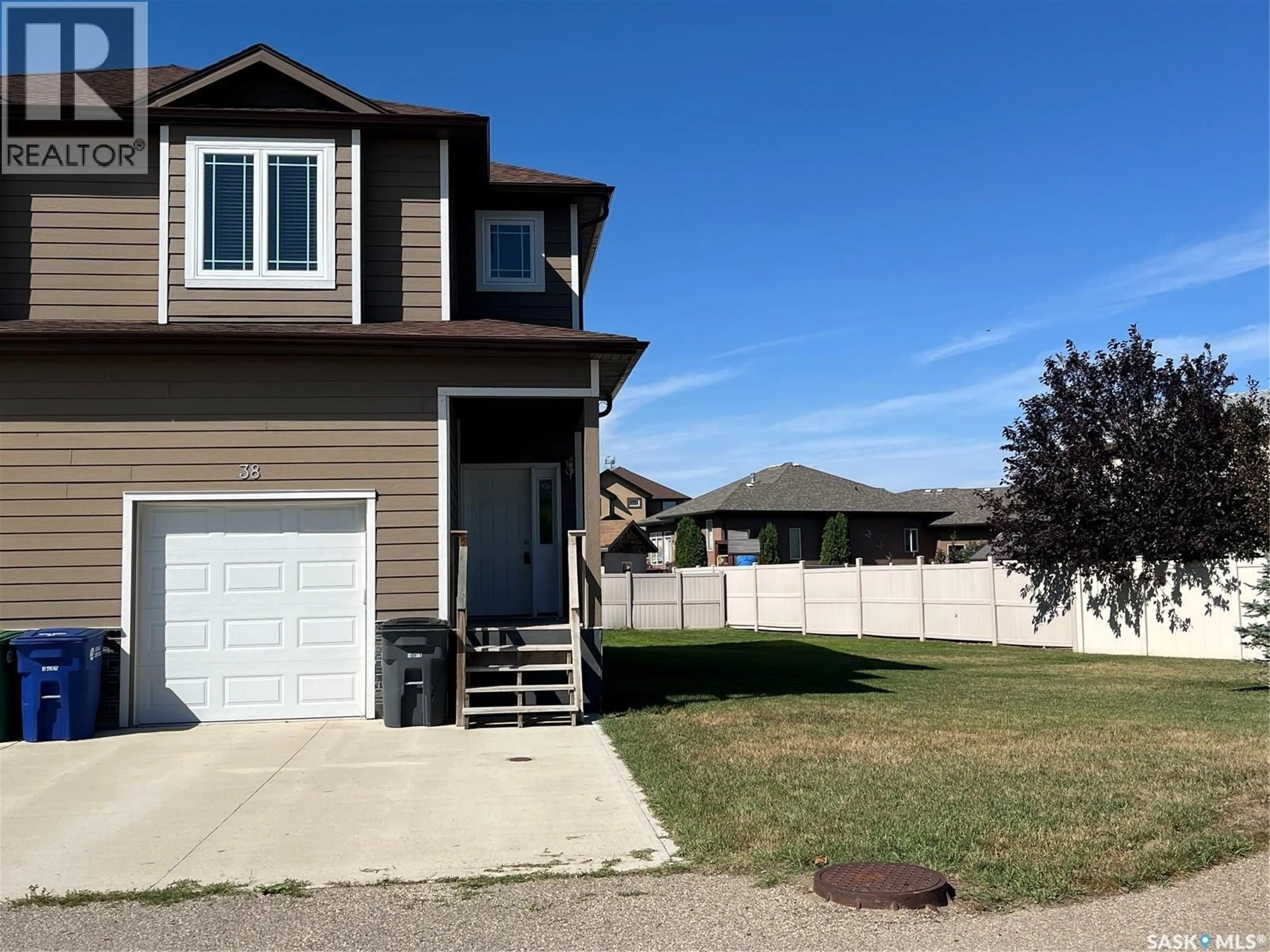 Home with vinyl exterior material, street for 38 MCKENZIE LANE, White City Saskatchewan S4L0B2