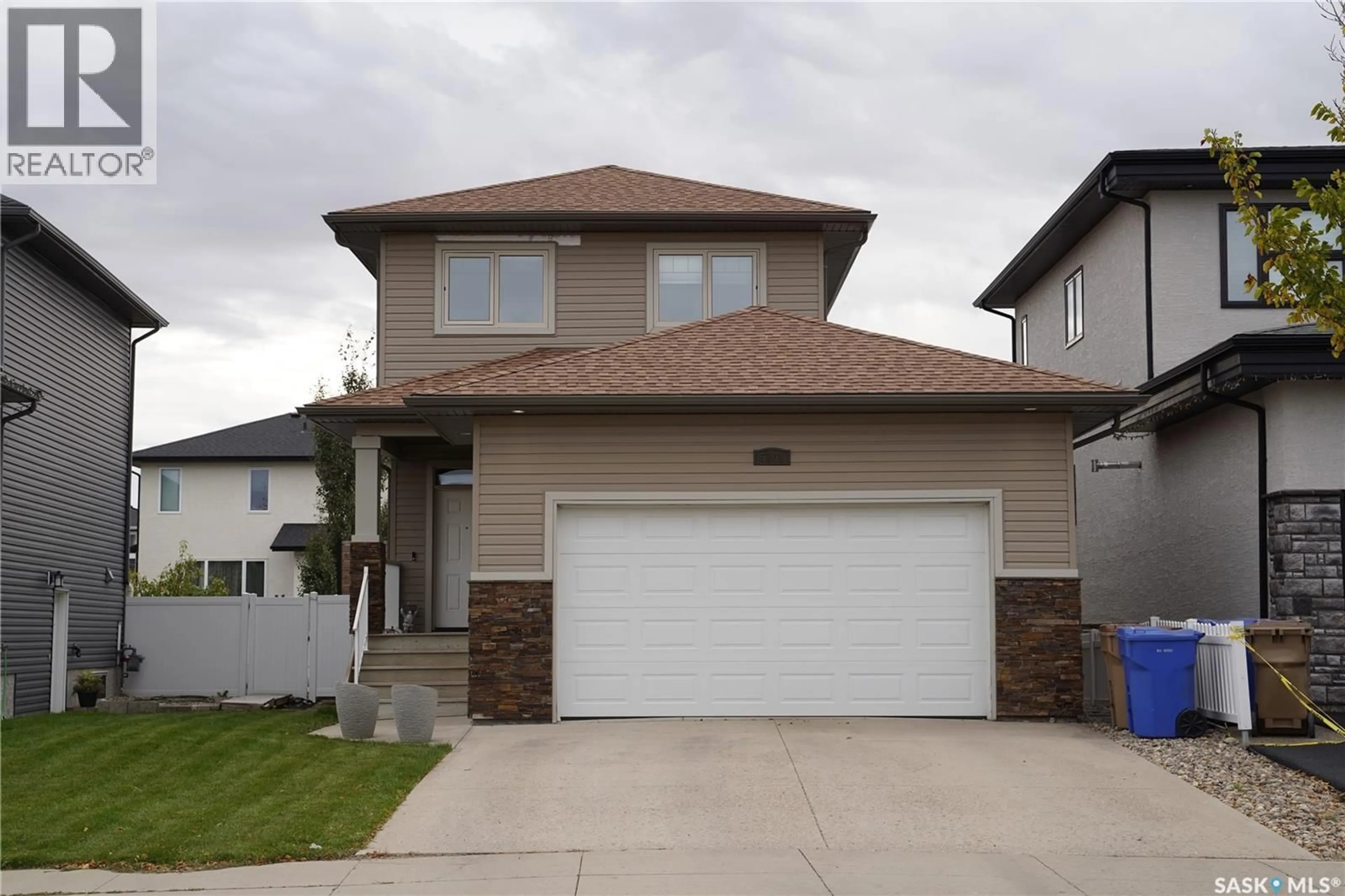 Home with vinyl exterior material, street for 5101 TUTOR WAY, Regina Saskatchewan S4W0H4