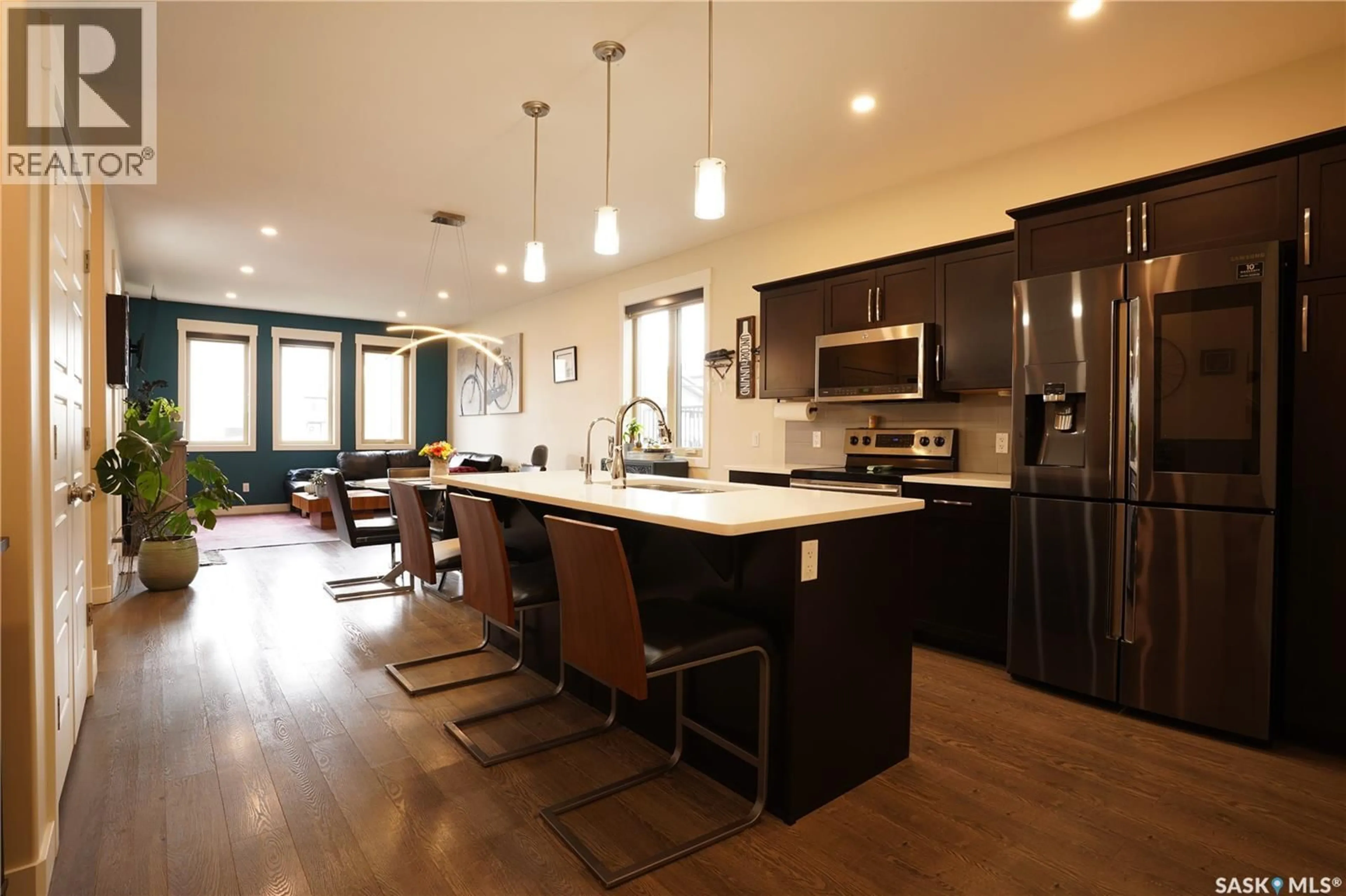 Open concept kitchen, wood/laminate floor for 5101 TUTOR WAY, Regina Saskatchewan S4W0H4