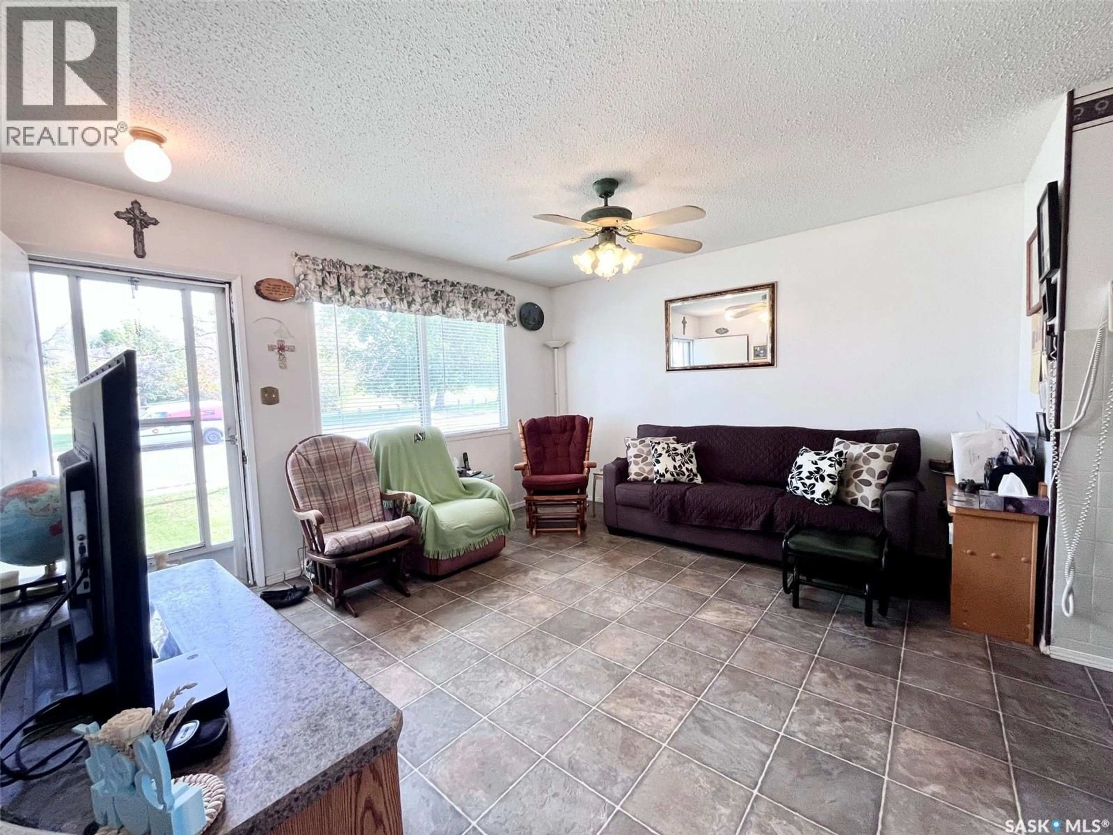 Living room with furniture, ceramic/tile floor for 99 BOWERMAN CRESCENT, Prince Albert Saskatchewan S6V6G3