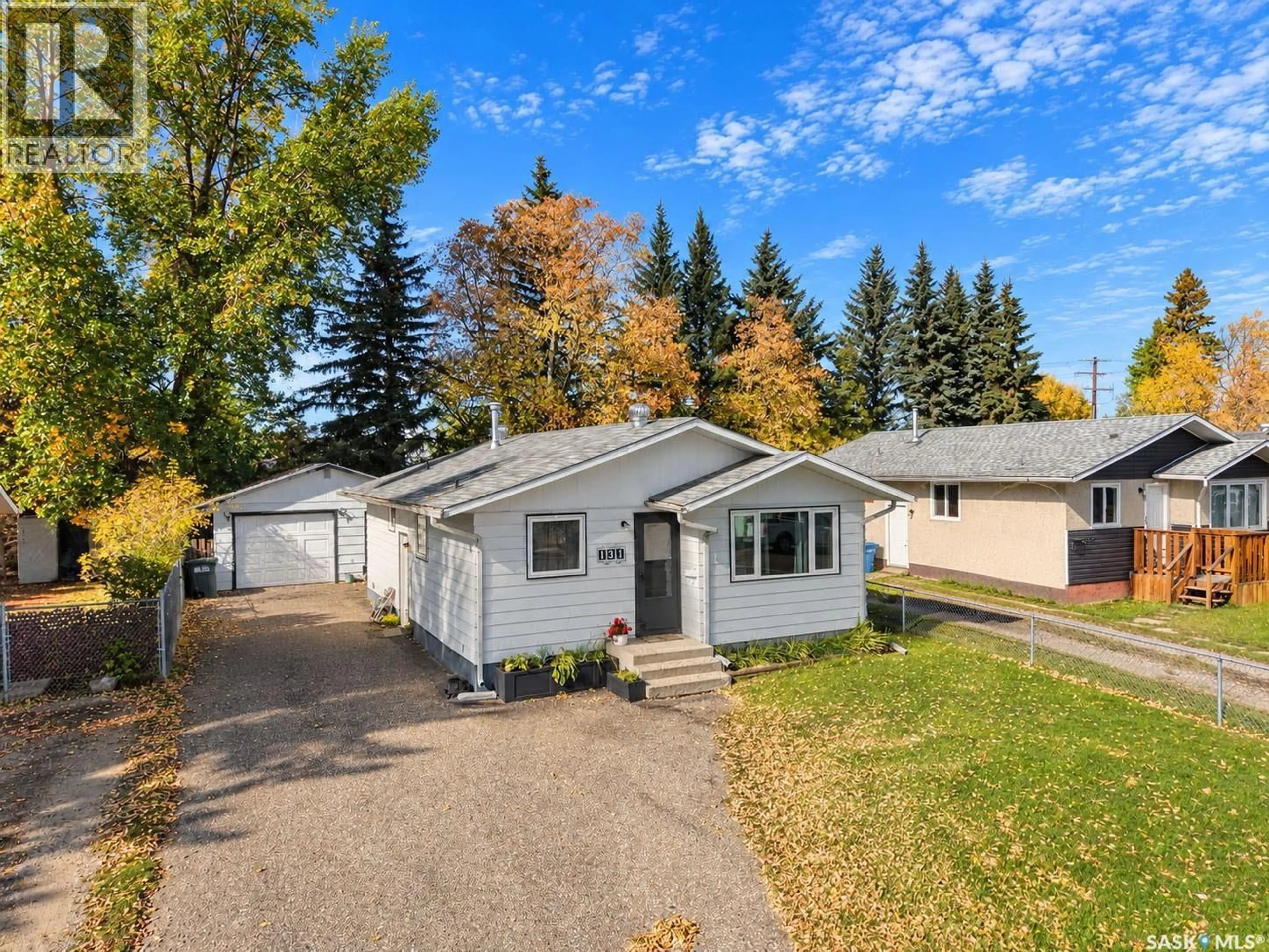 Home with vinyl exterior material, street for 131 MCINTOSH DRIVE, Prince Albert Saskatchewan S6V6H2